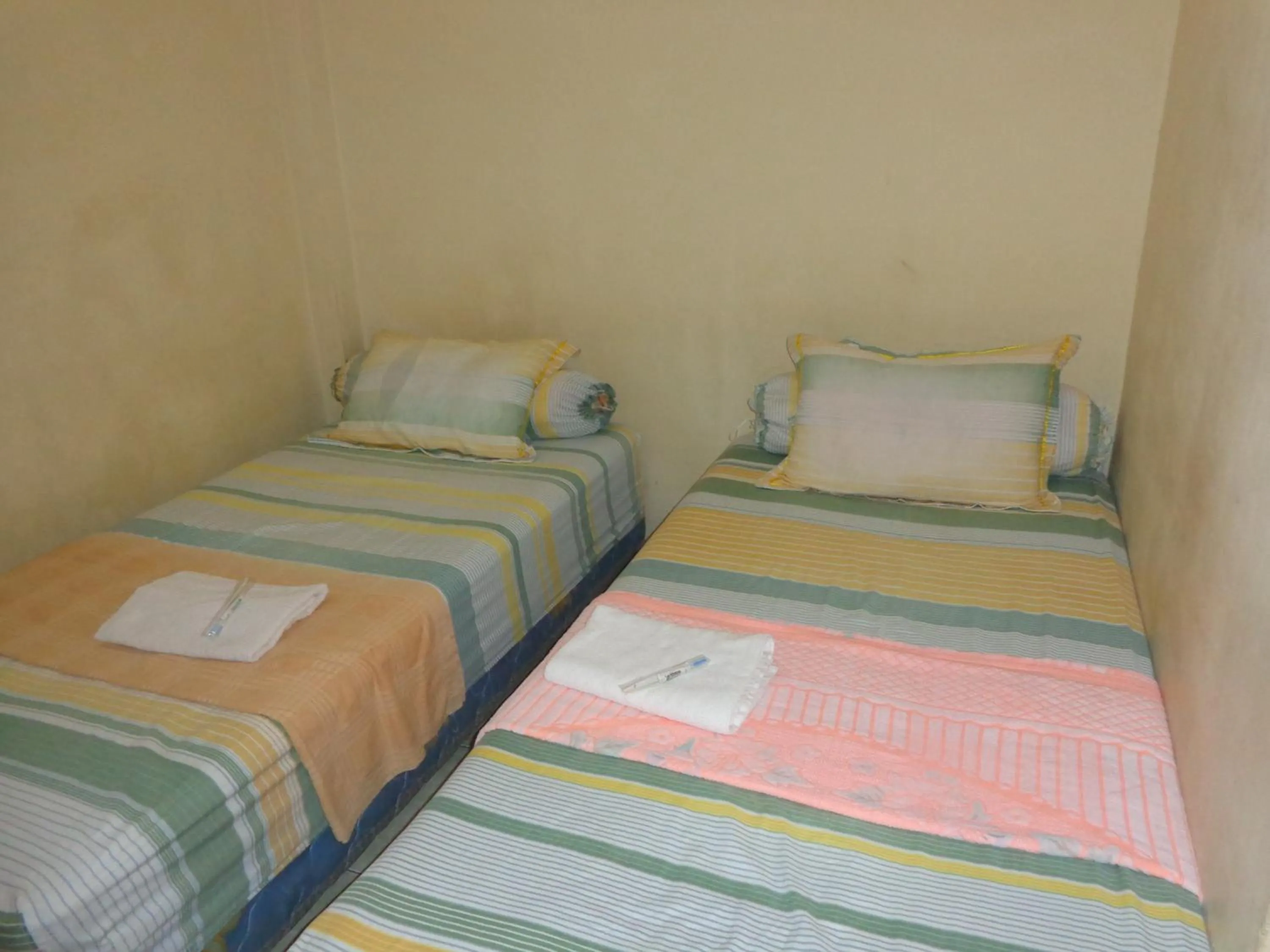 Bed in Hotel Musafir Inn