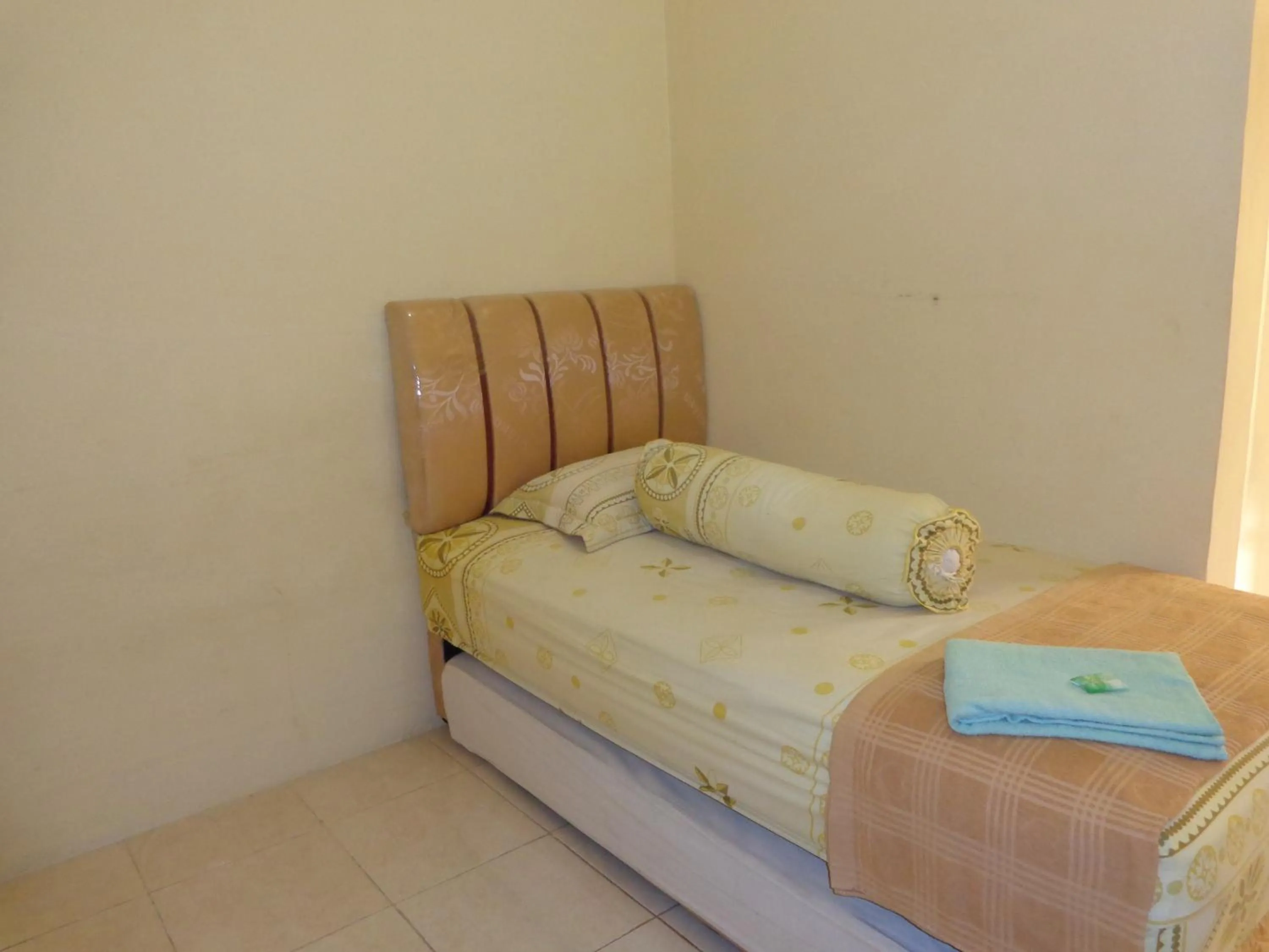 Bed in Hotel Musafir Inn