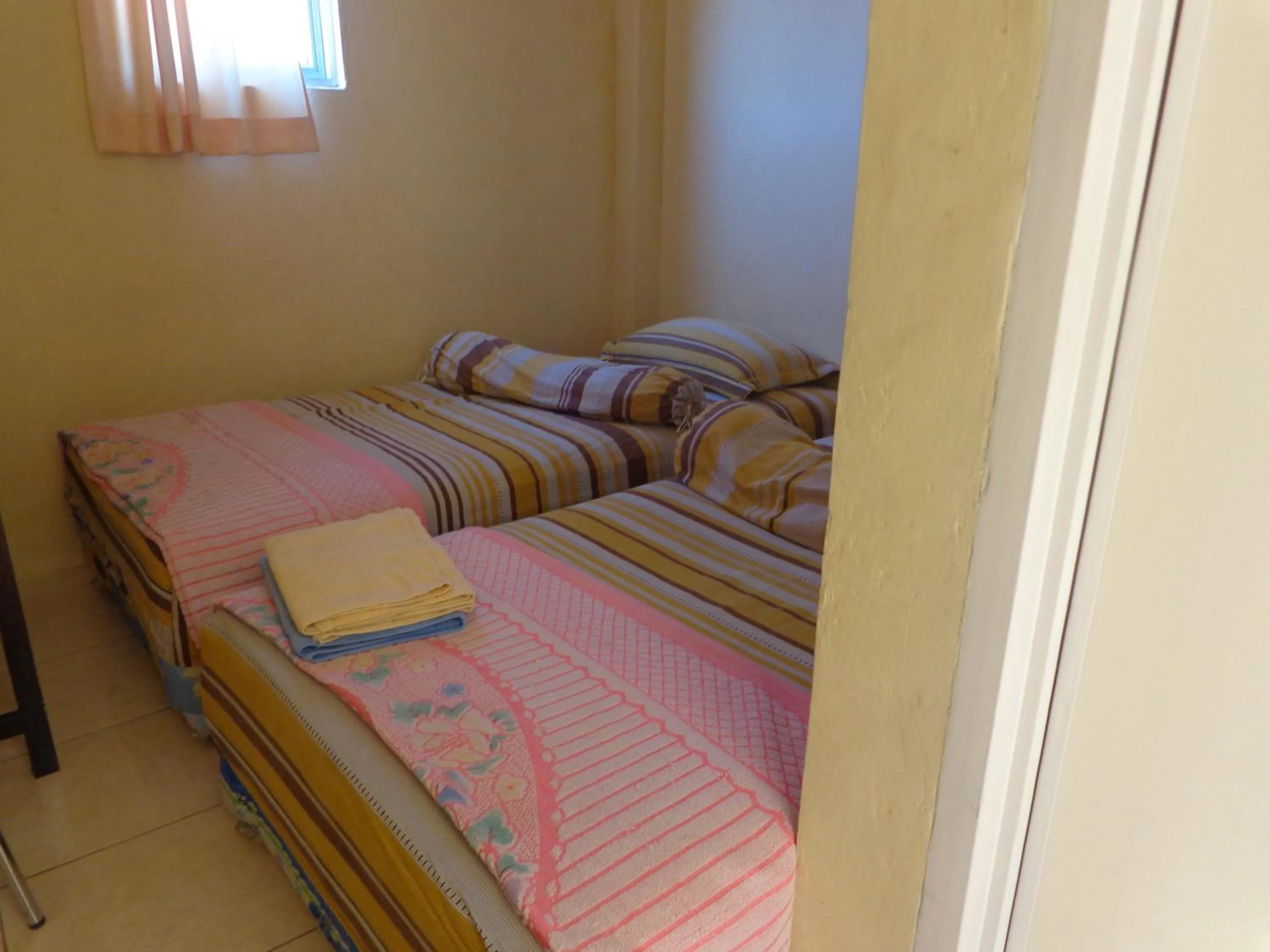 Bed in Hotel Musafir Inn