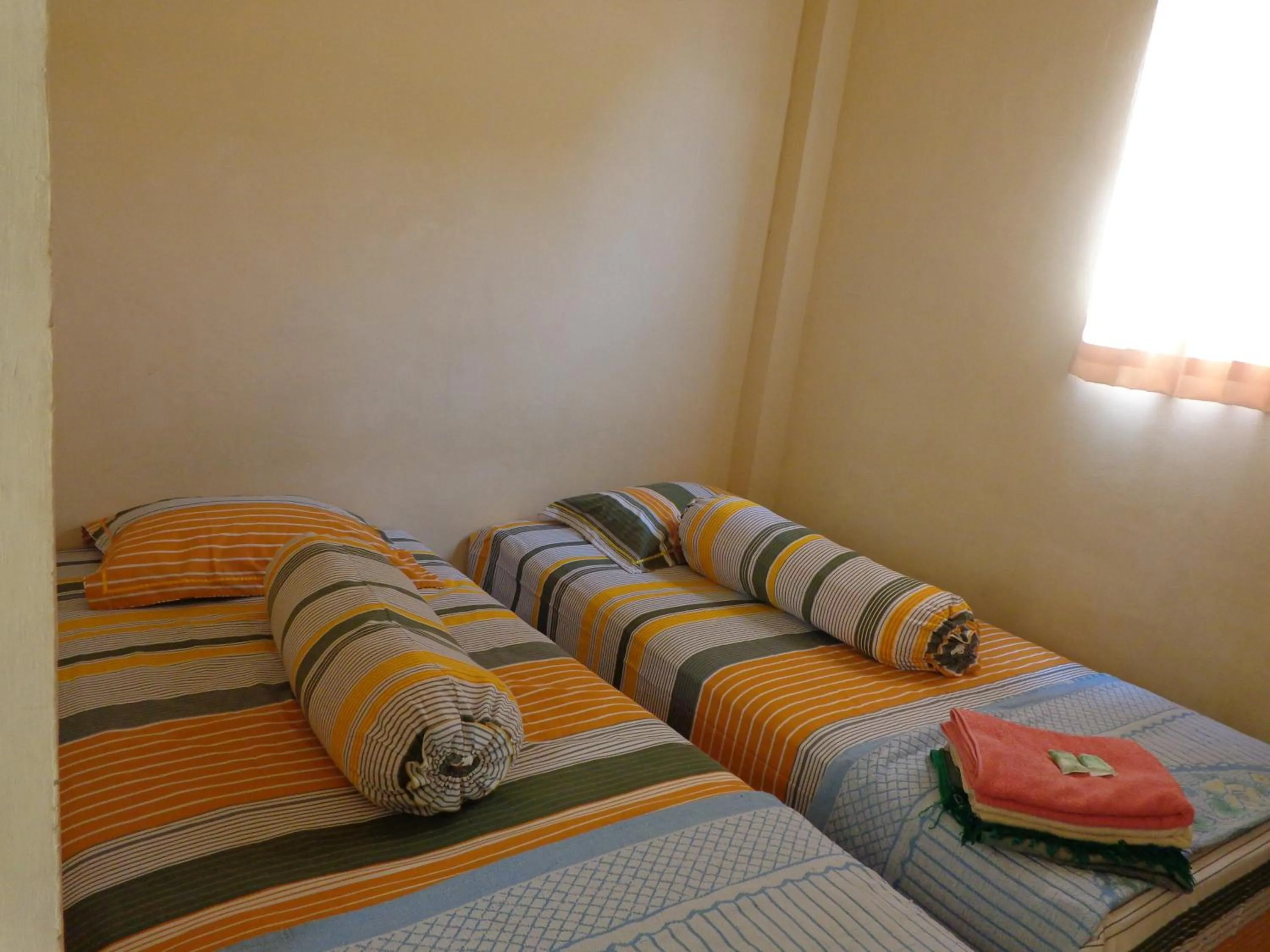 Bed in Hotel Musafir Inn