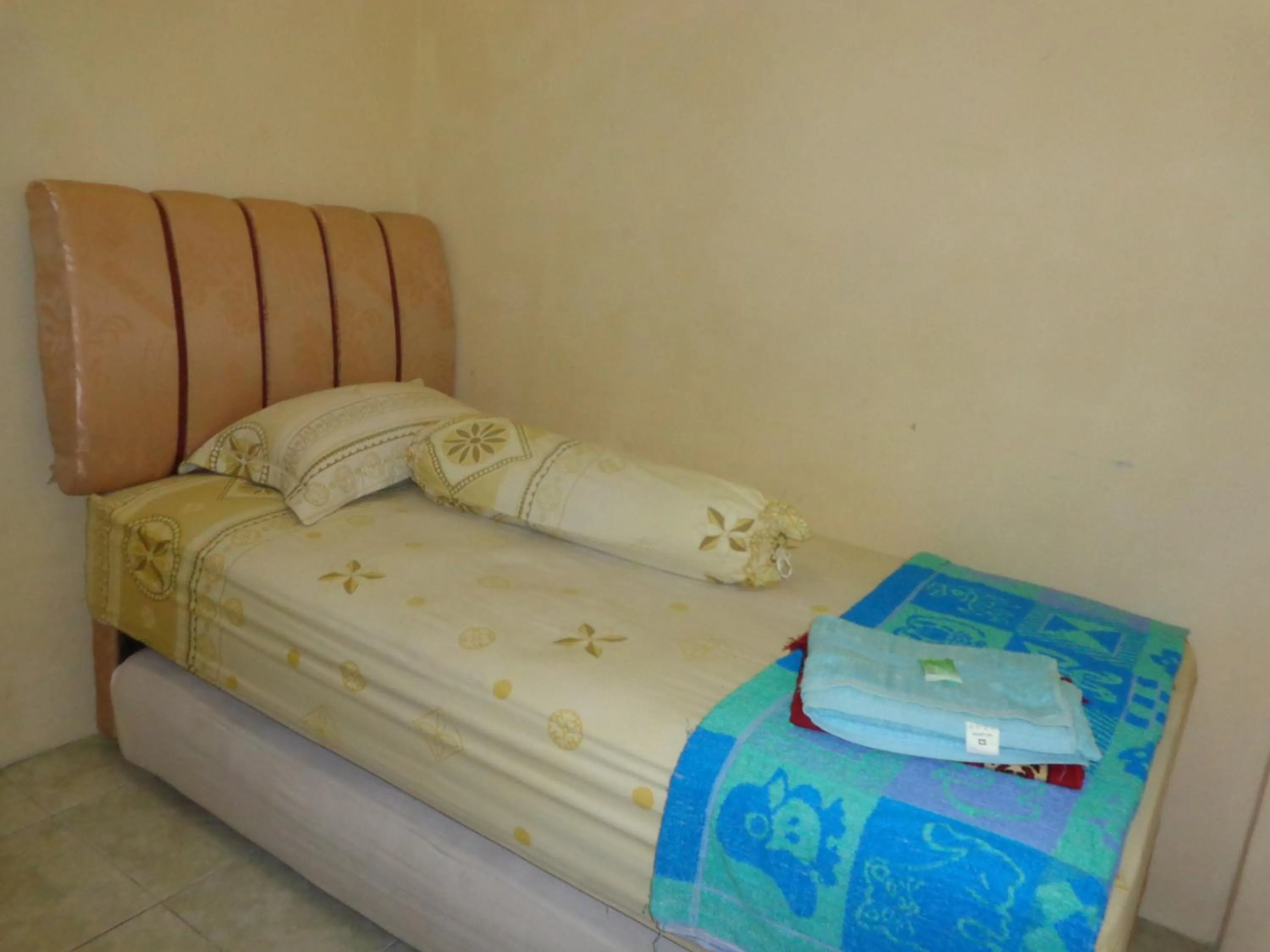 Bed in Hotel Musafir Inn