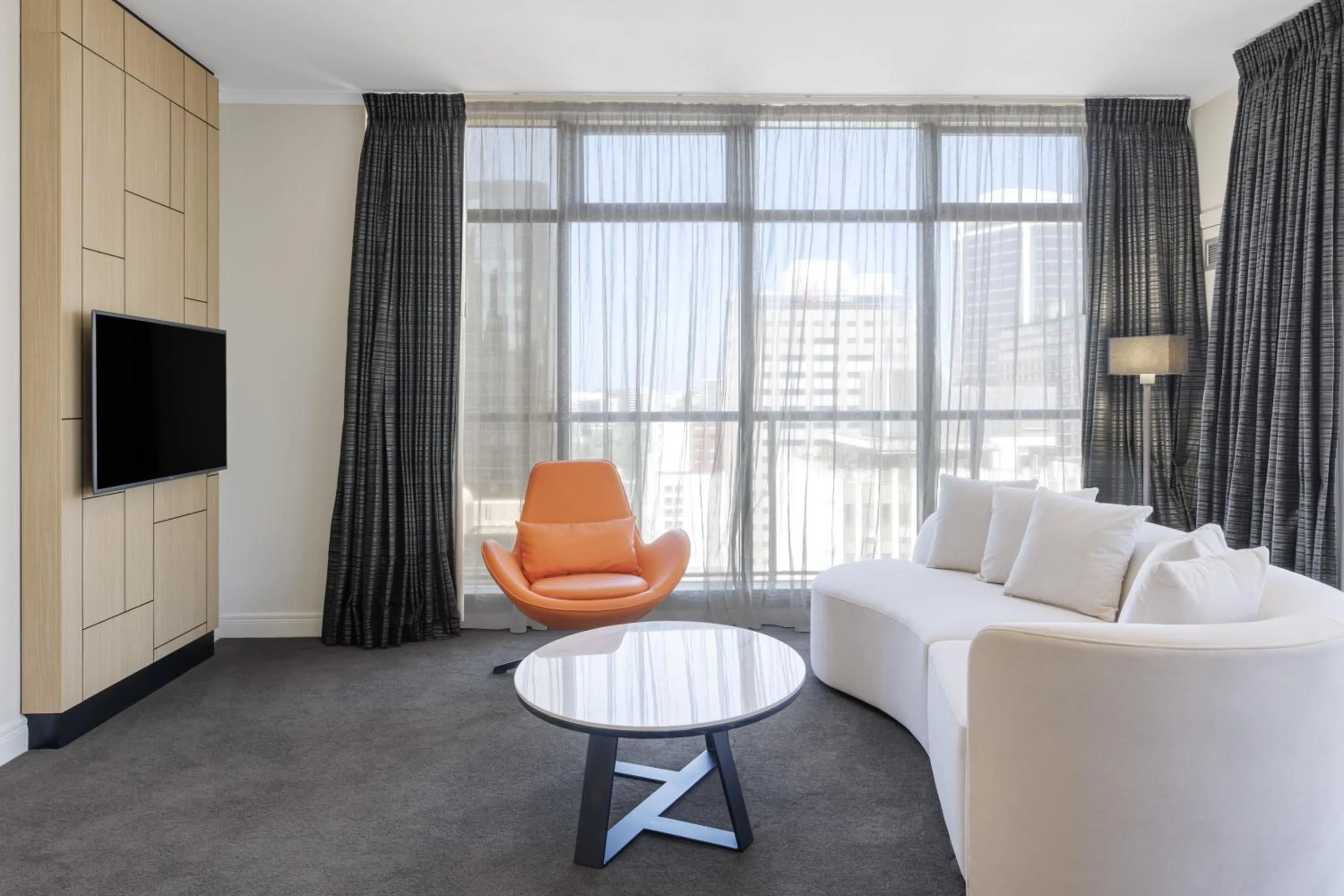 Living room in Adina Citylife Auckland