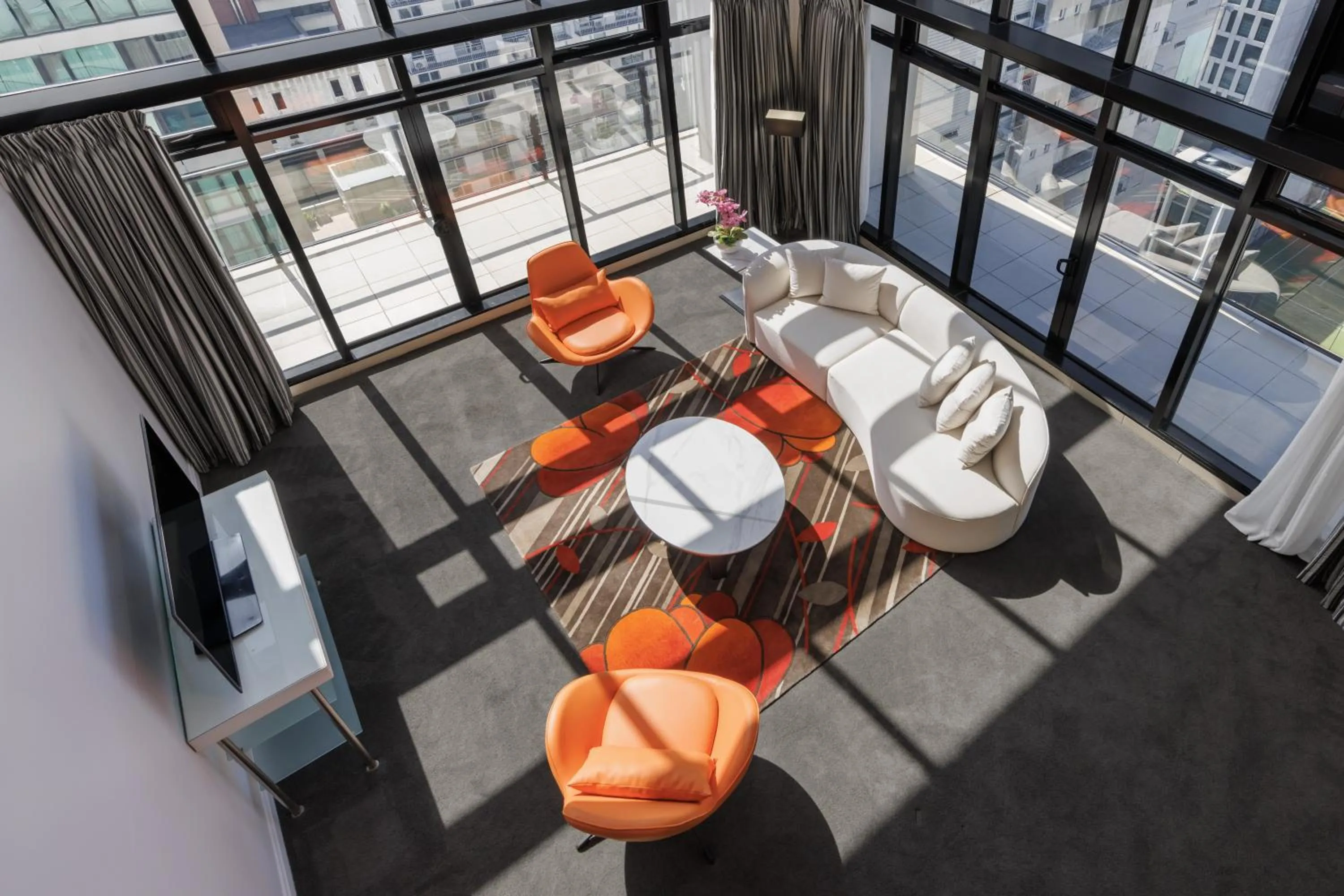 Living room in Adina Citylife Auckland