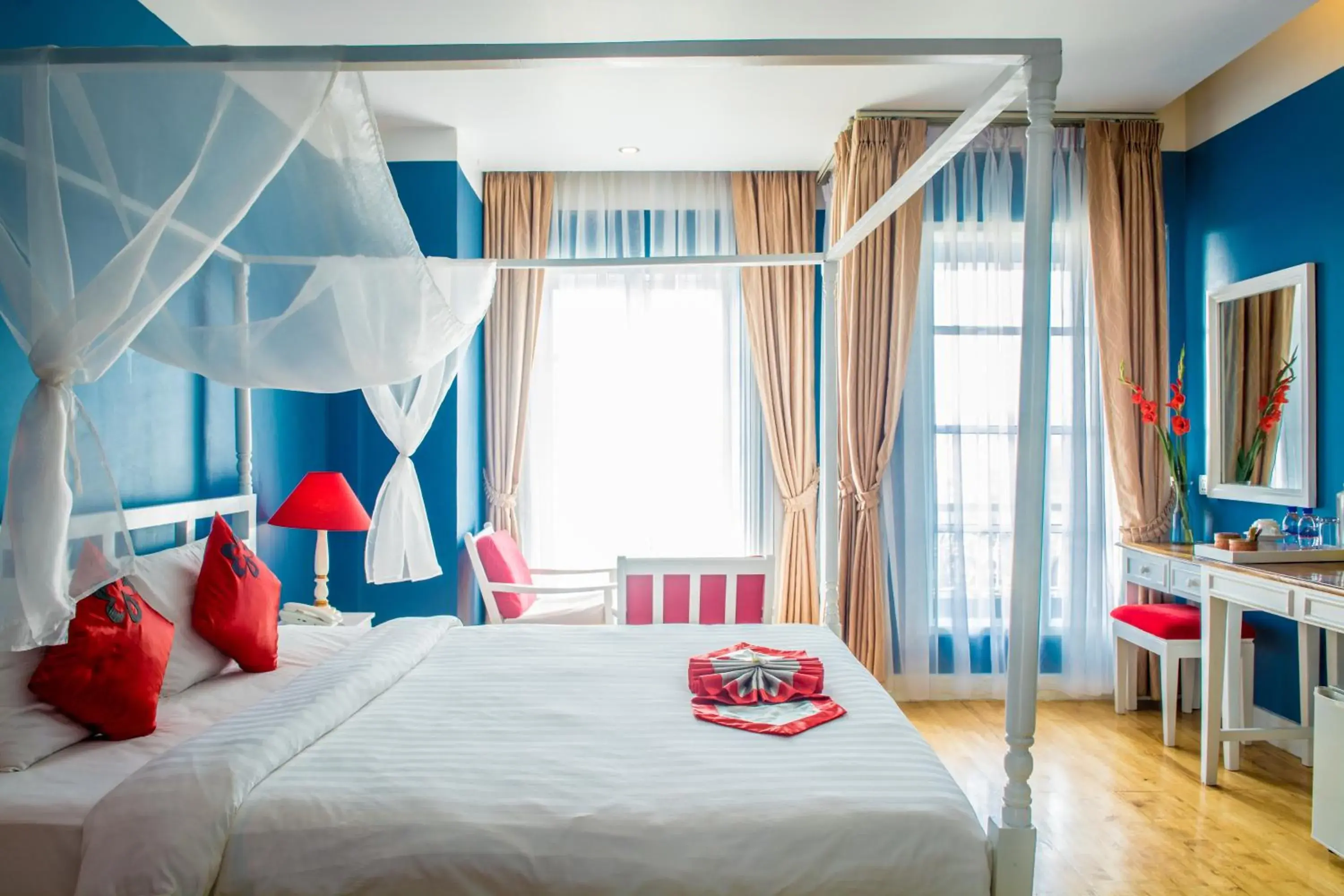 Bed in The Frangipani Royal Palace Hotel Bed in The Frangipani Royal Palace Hotel