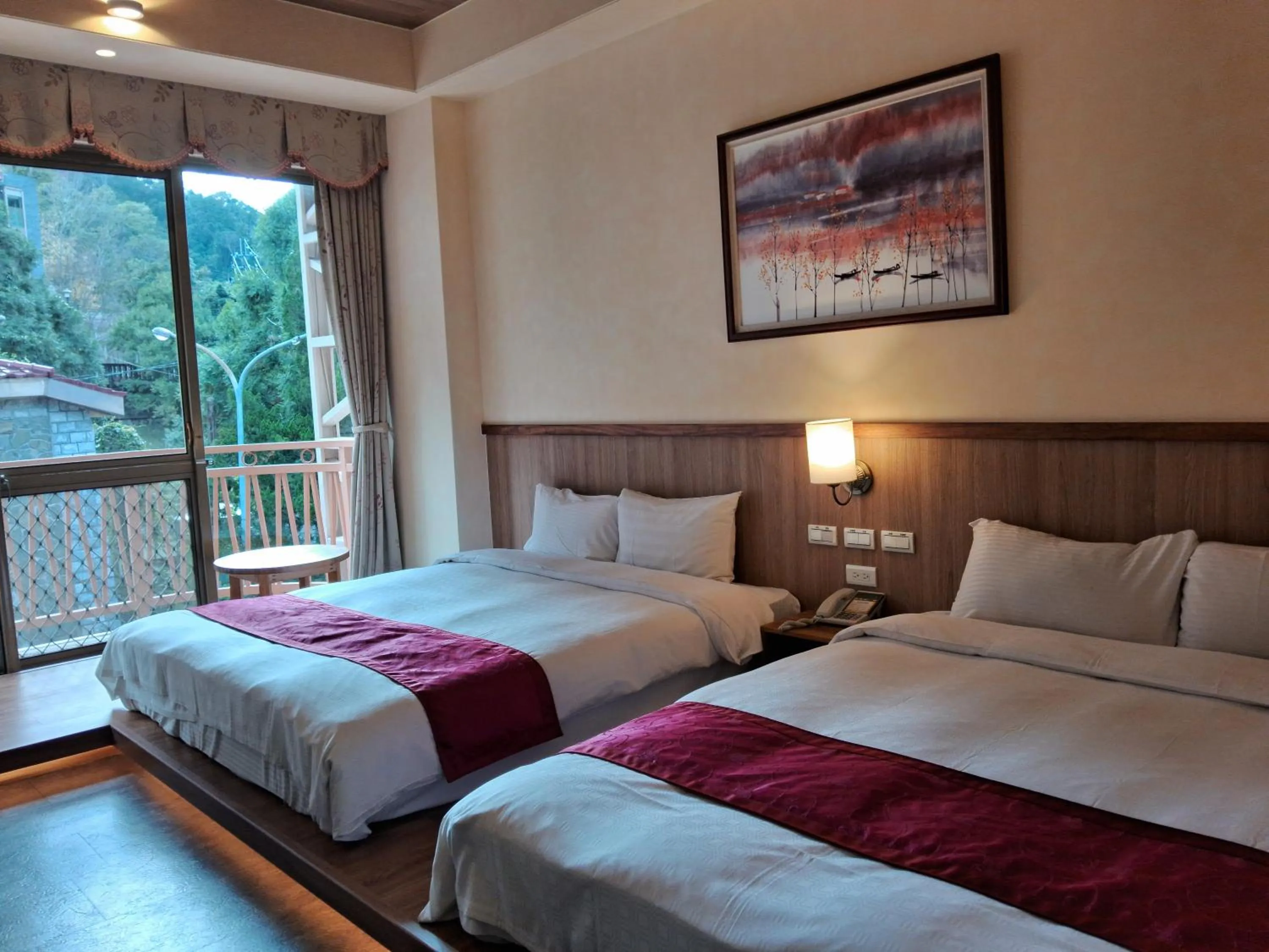 Bed in Ku Kuan Resort Hotel