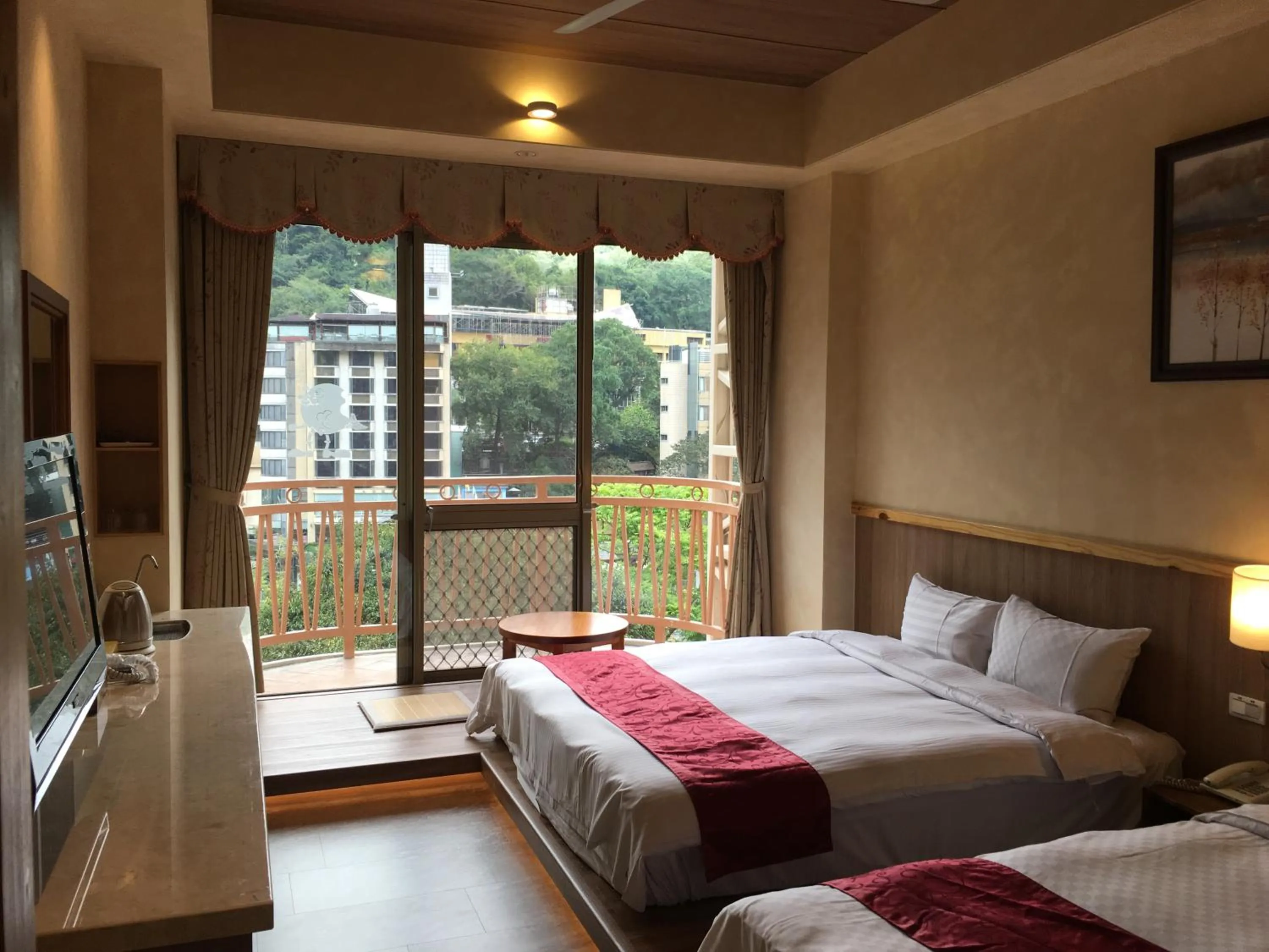 Bed in Ku Kuan Resort Hotel