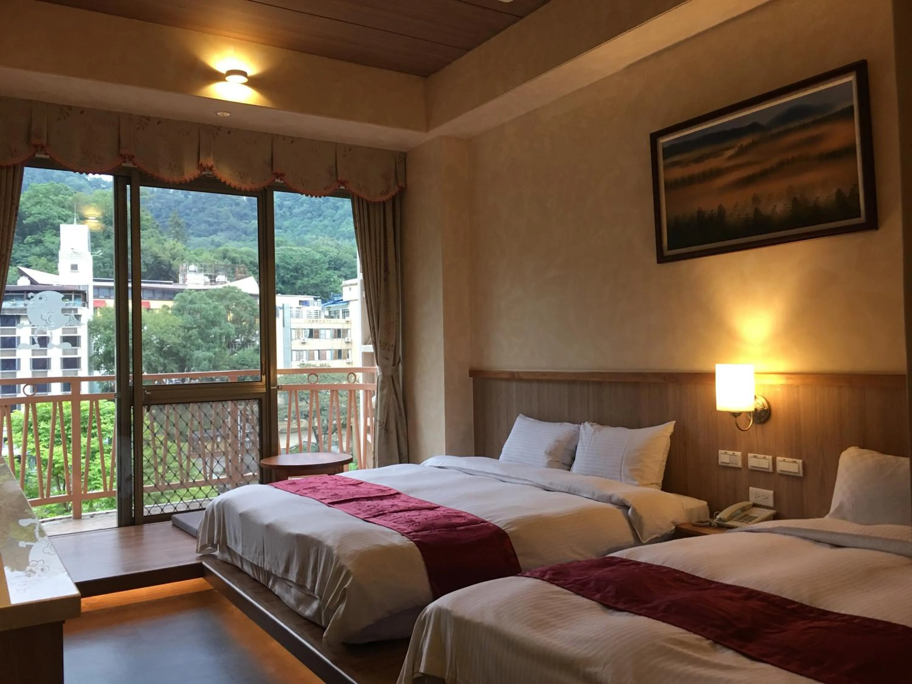 Bed in Ku Kuan Resort Hotel