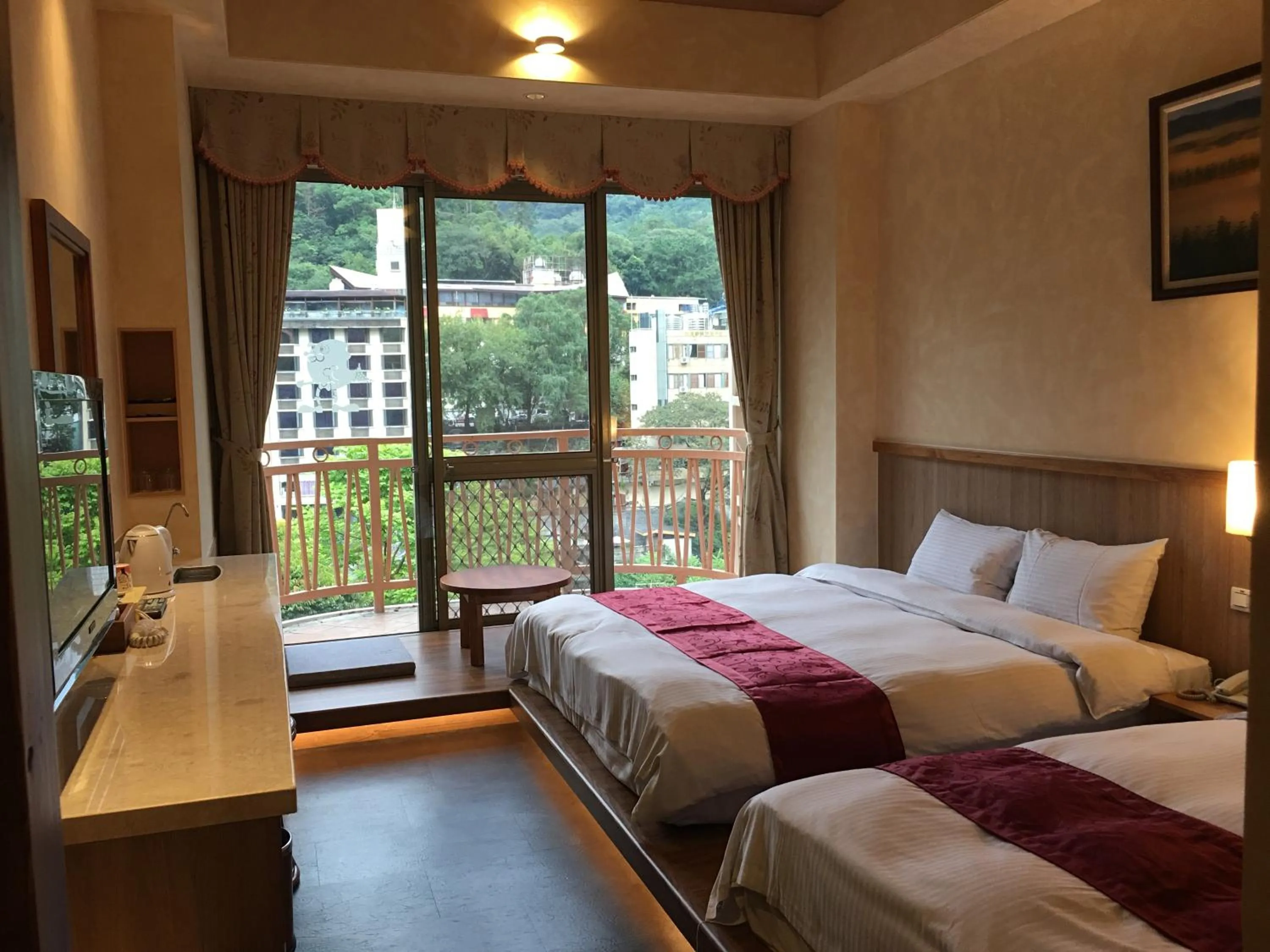 Bed in Ku Kuan Resort Hotel