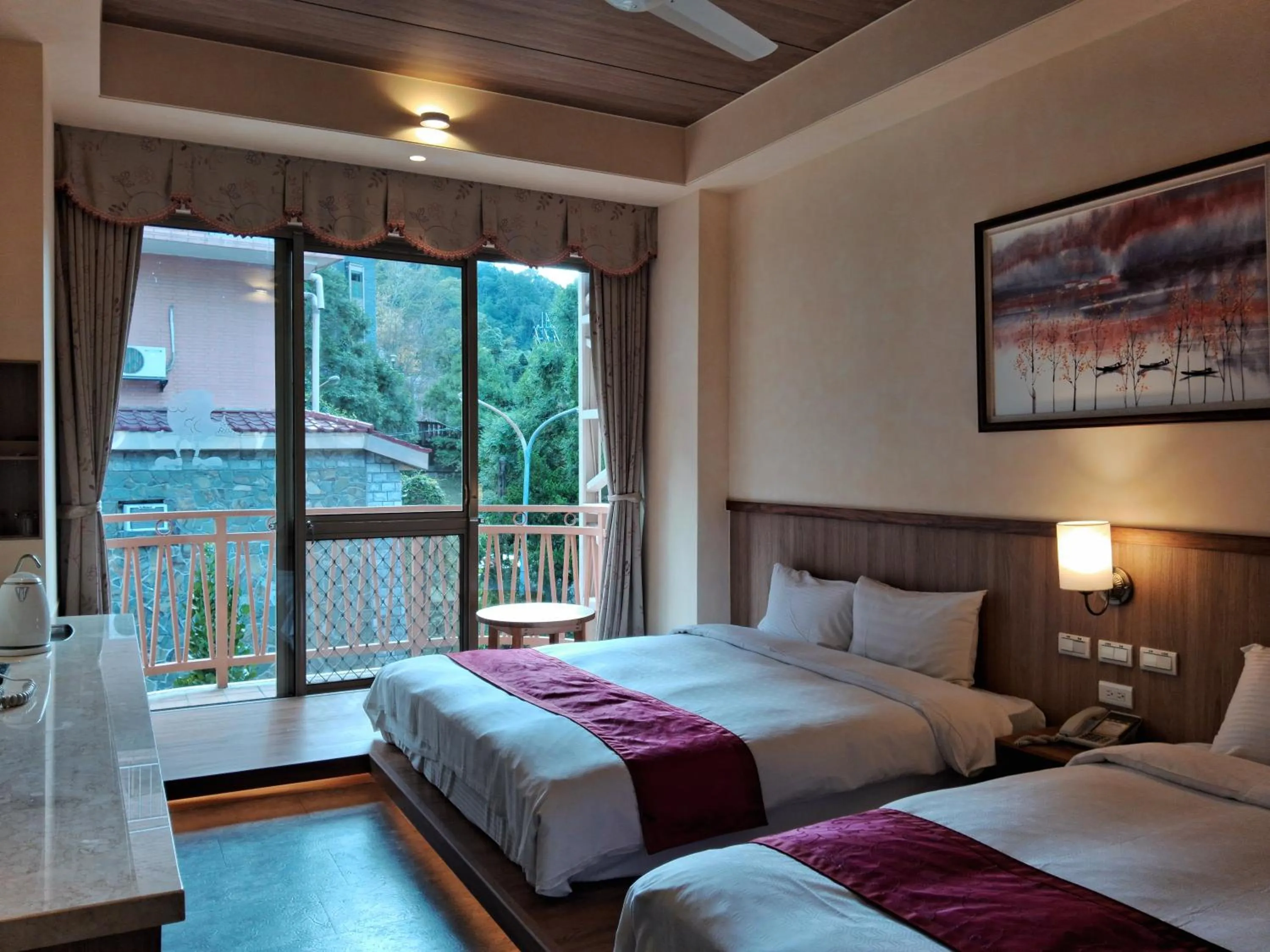 Bed in Ku Kuan Resort Hotel