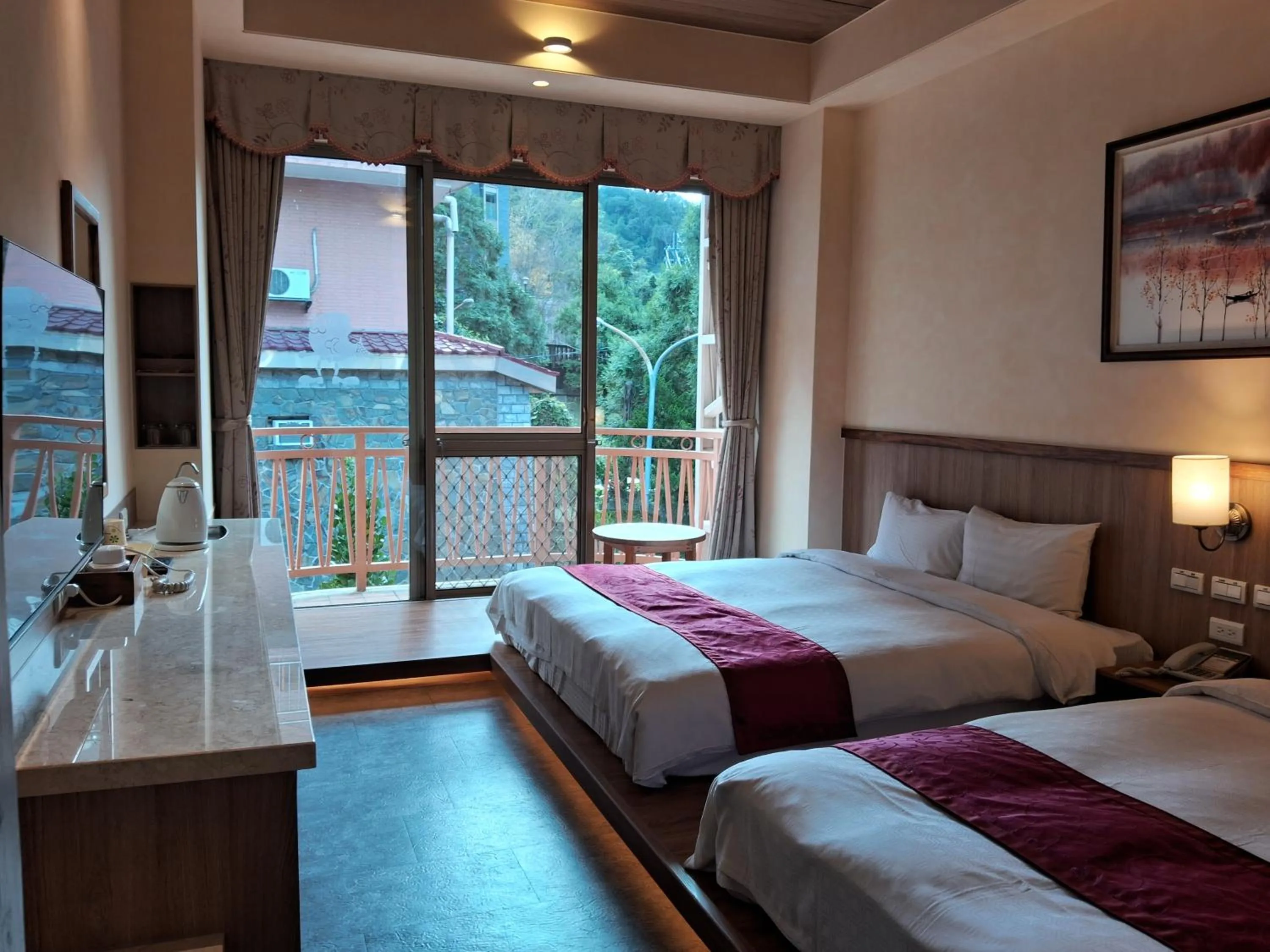 Bed in Ku Kuan Resort Hotel