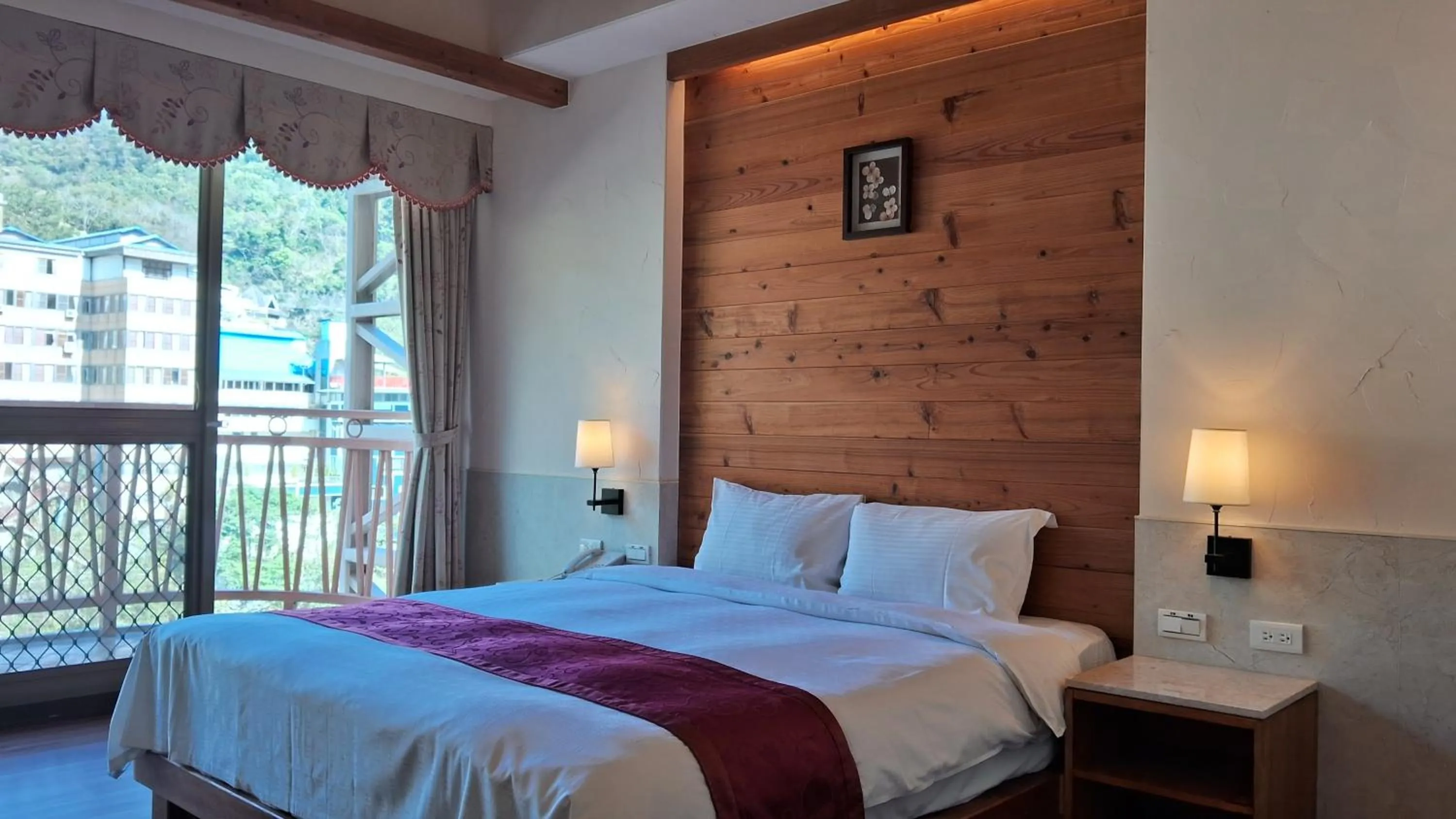 Bed in Ku Kuan Resort Hotel