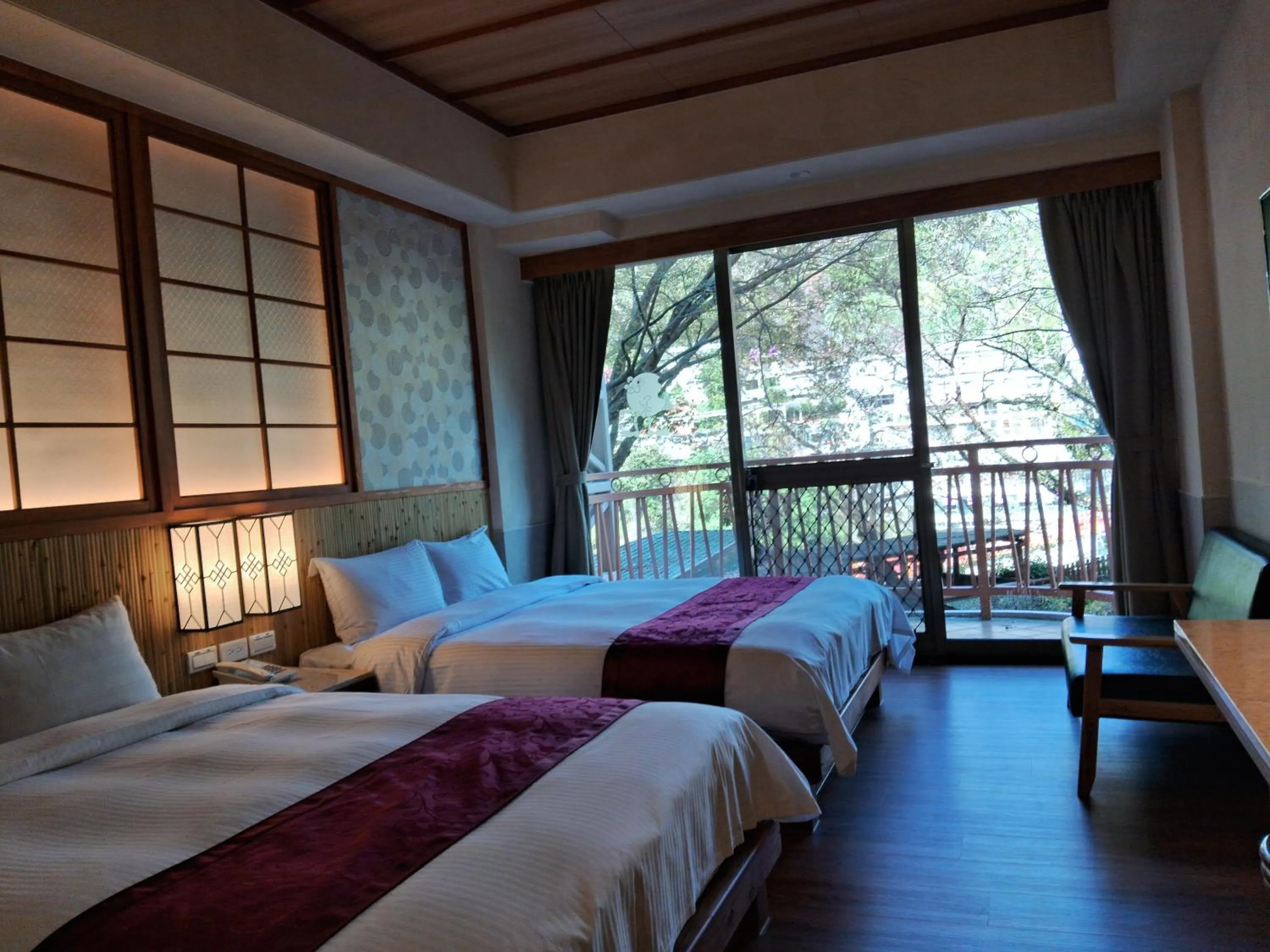 Bed in Ku Kuan Resort Hotel