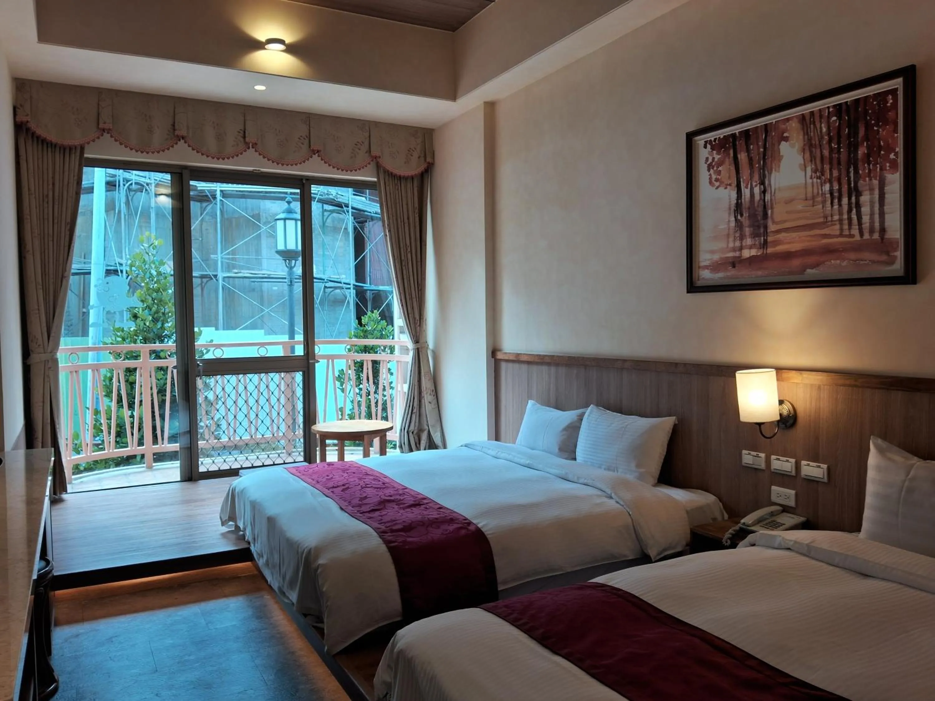 Bed in Ku Kuan Resort Hotel