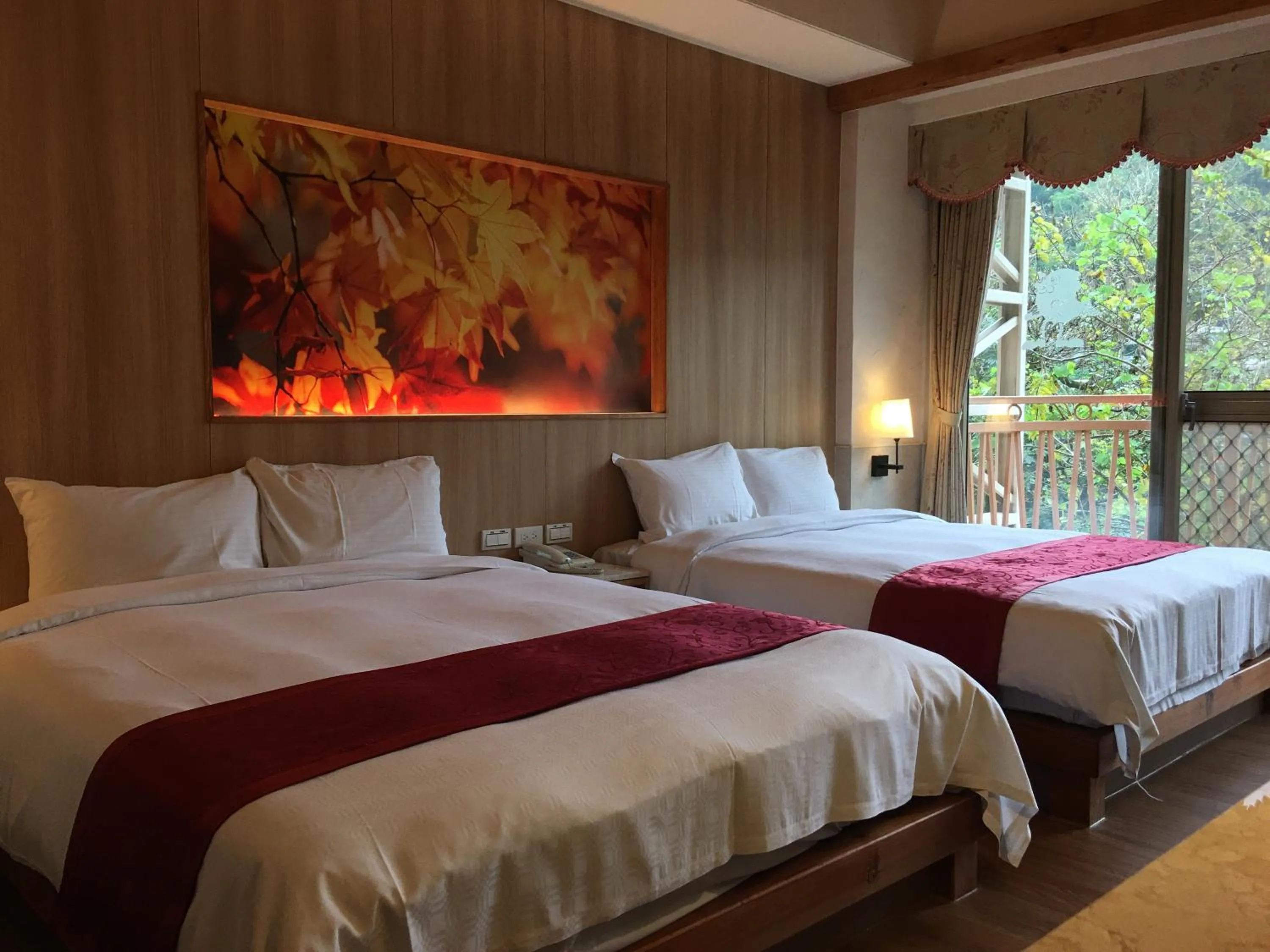 Bed in Ku Kuan Resort Hotel