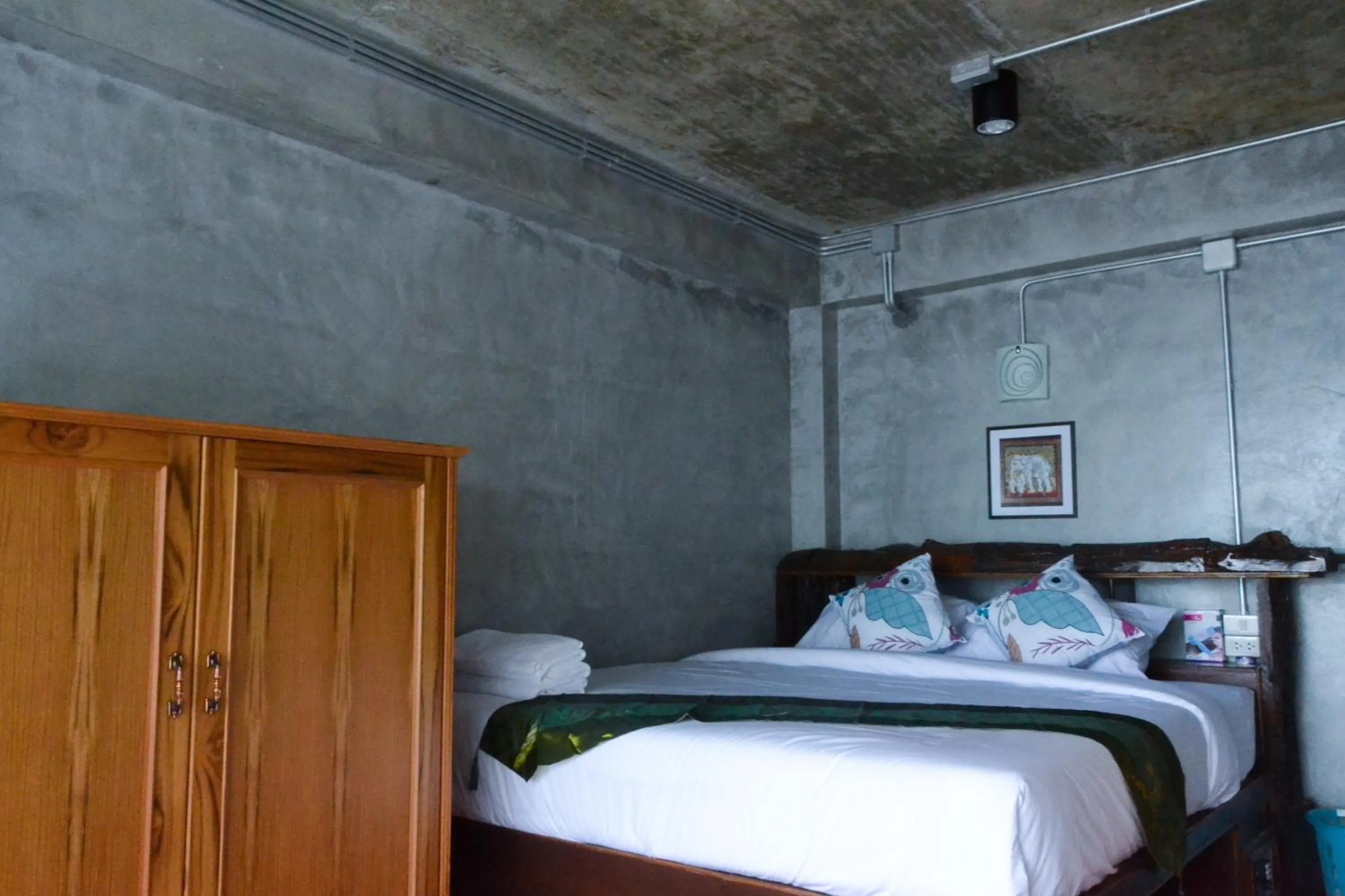 Bed in Baan Tubkaek Hotel