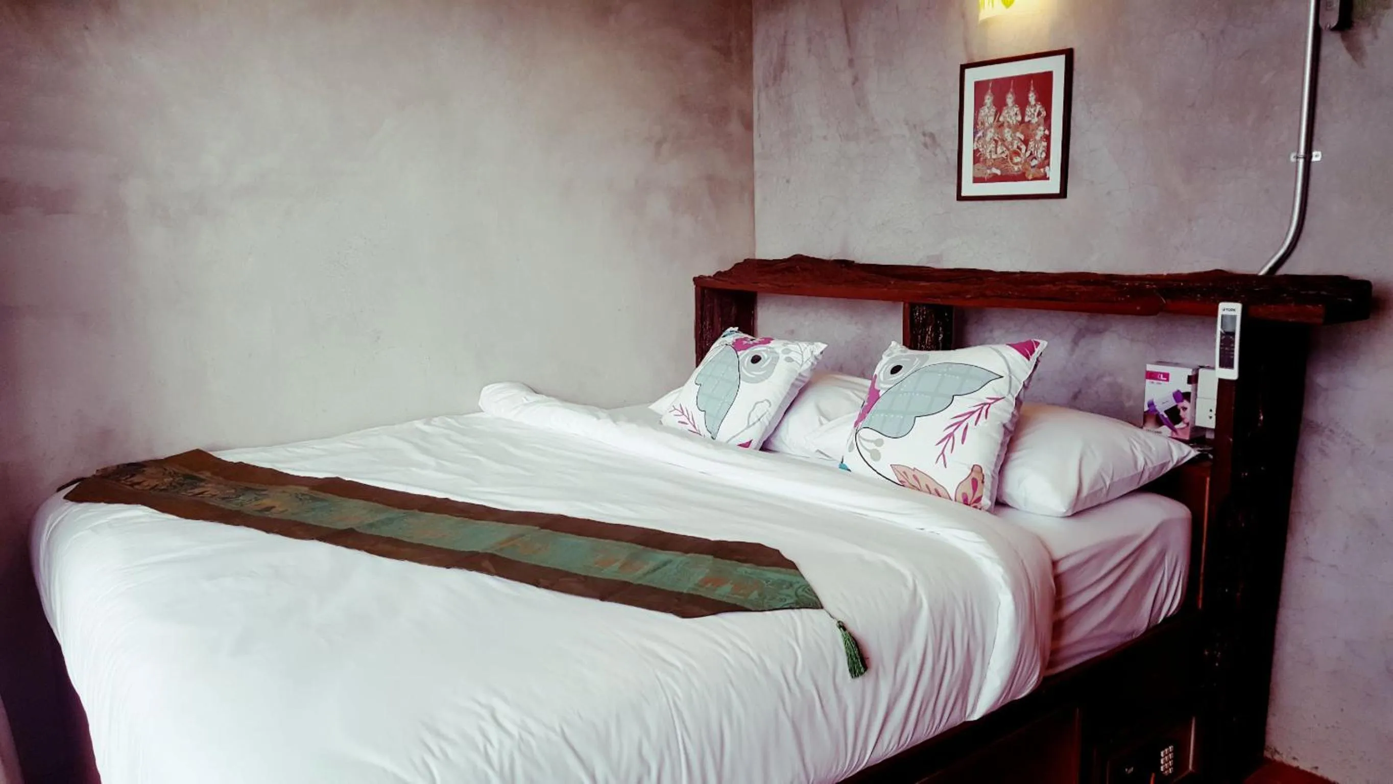 Bed in Baan Tubkaek Hotel