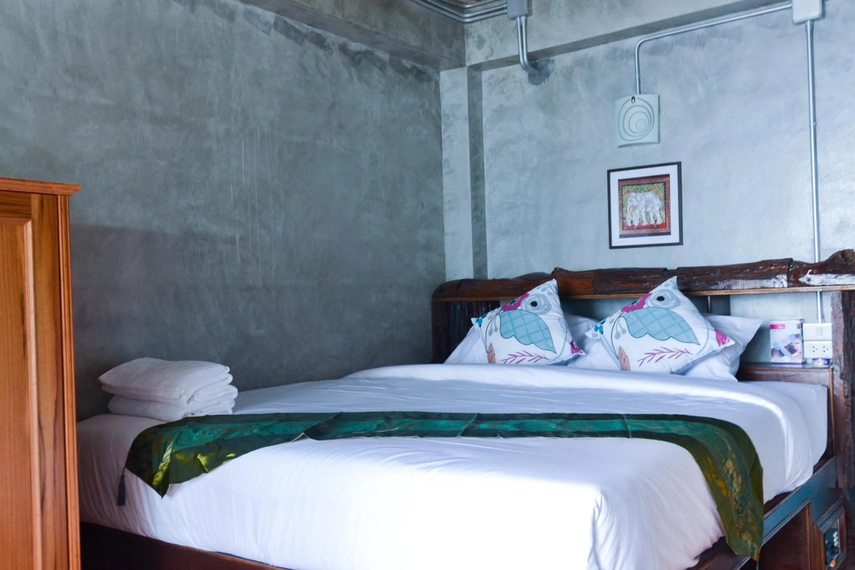 Bed in Baan Tubkaek Hotel