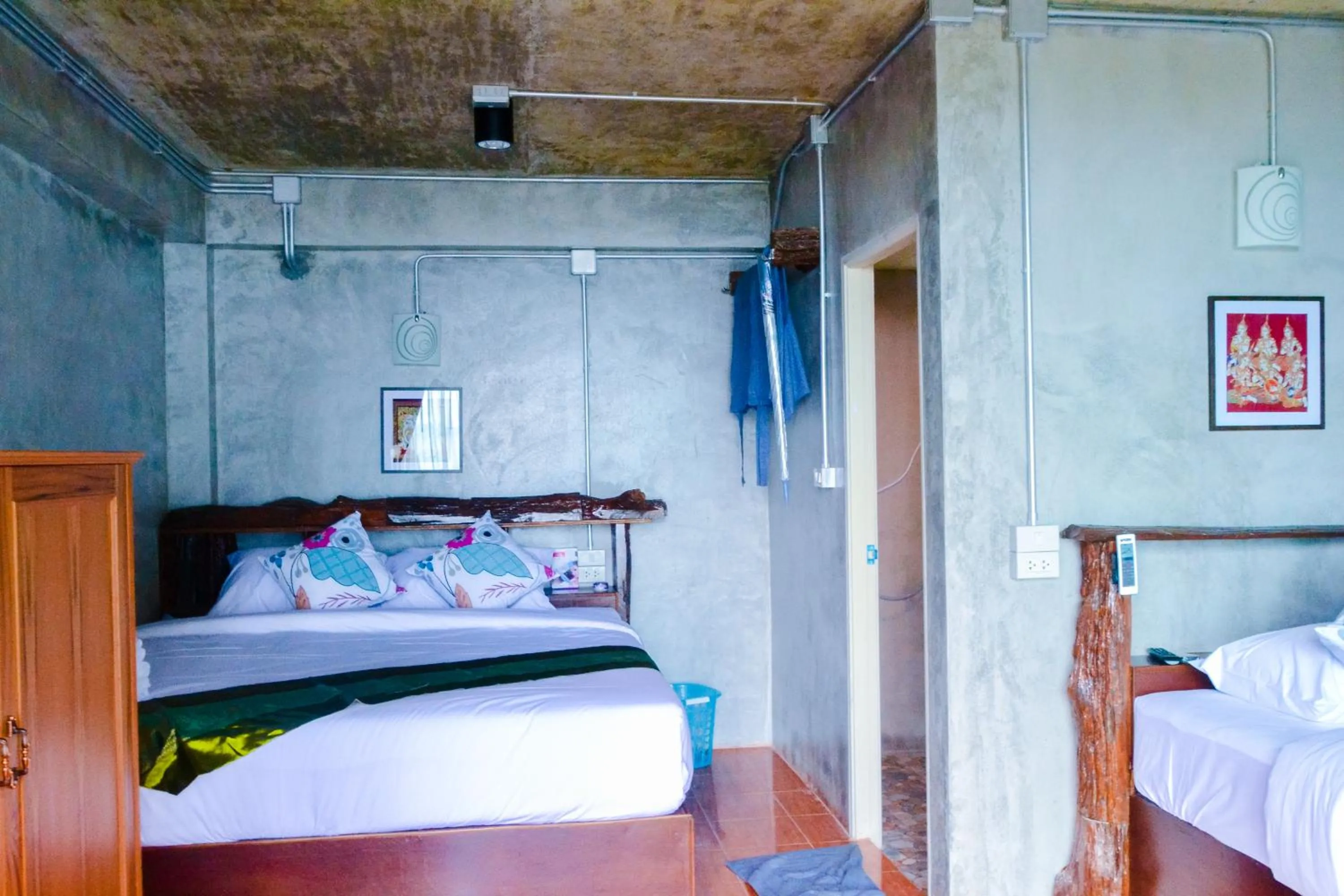 Bed in Baan Tubkaek Hotel