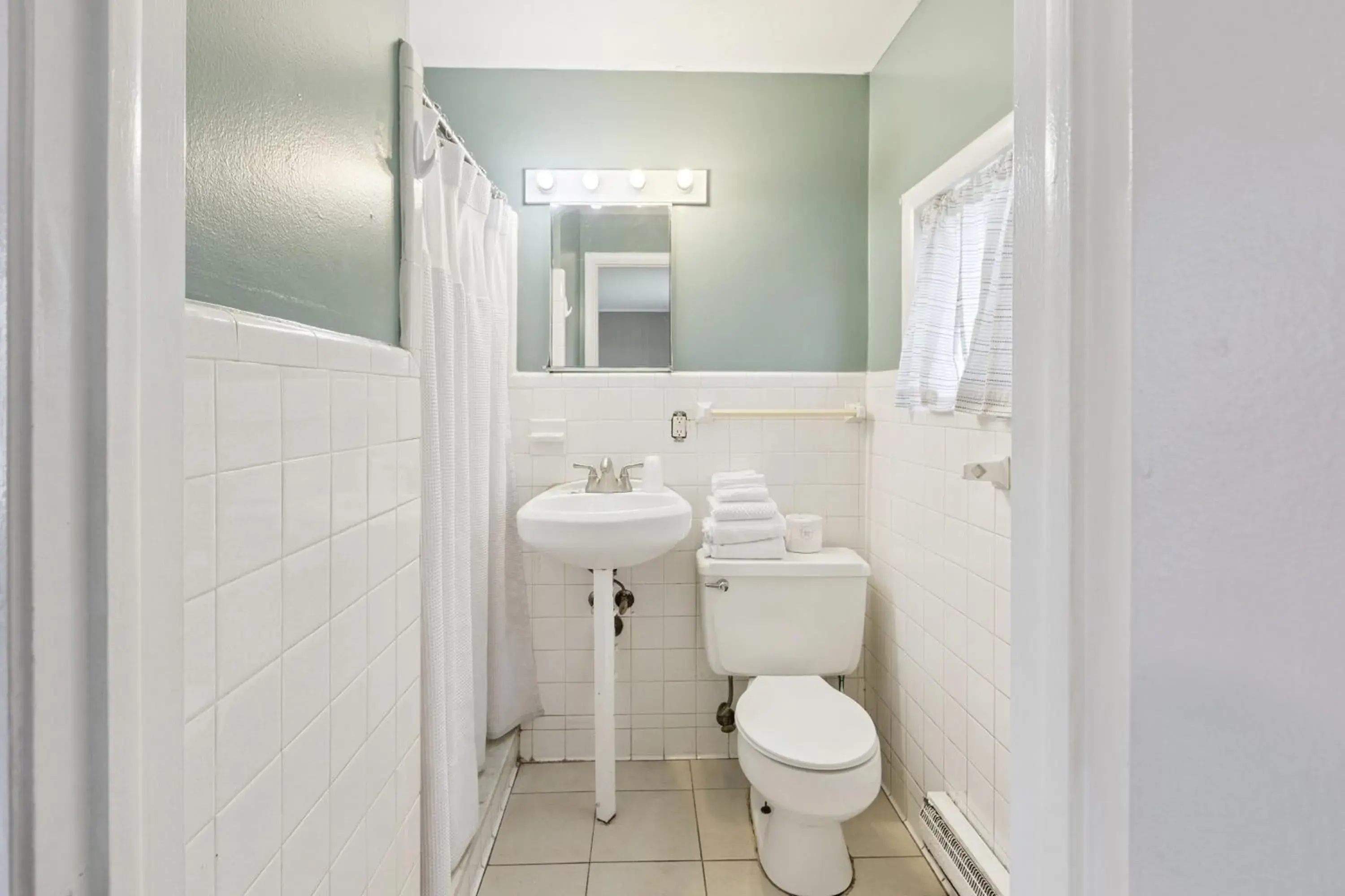 Bathroom in Currys Motel by OYO Saginaw MI Bathroom in Currys Motel by OYO Saginaw MI