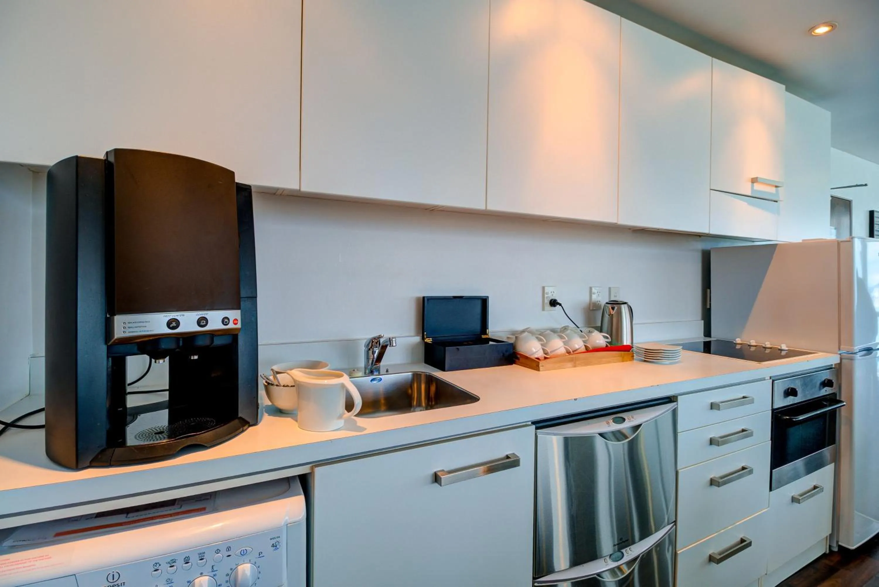 Kitchen or kitchenette in The Quadrant Hotel & Suites