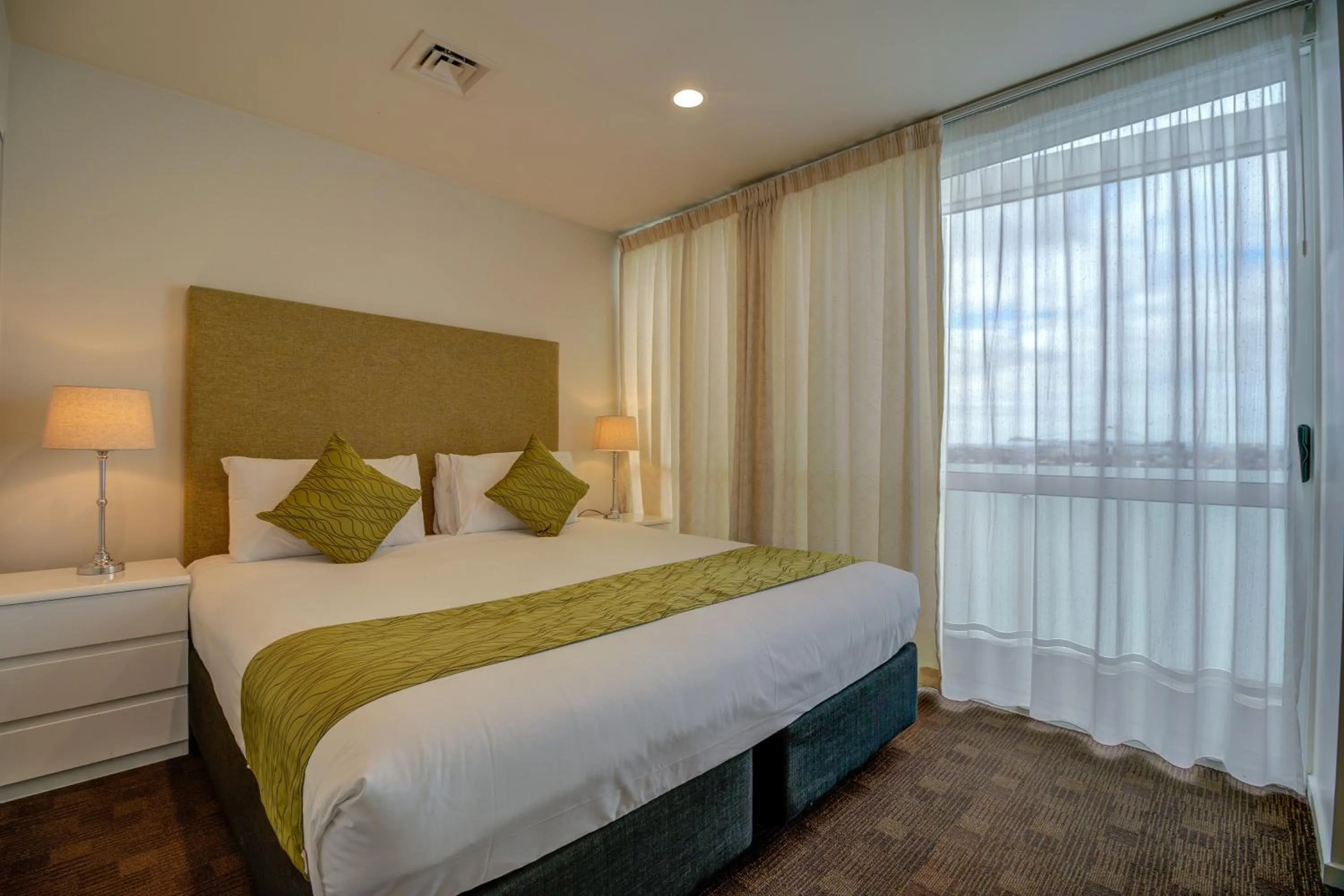 Bed in The Quadrant Hotel & Suites