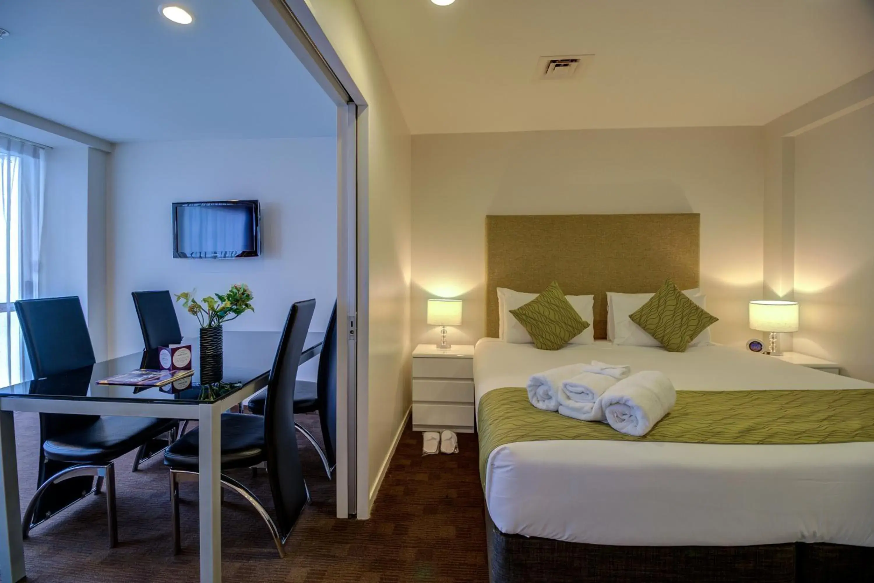 Bed in The Quadrant Hotel & Suites Bed in The Quadrant Hotel & Suites