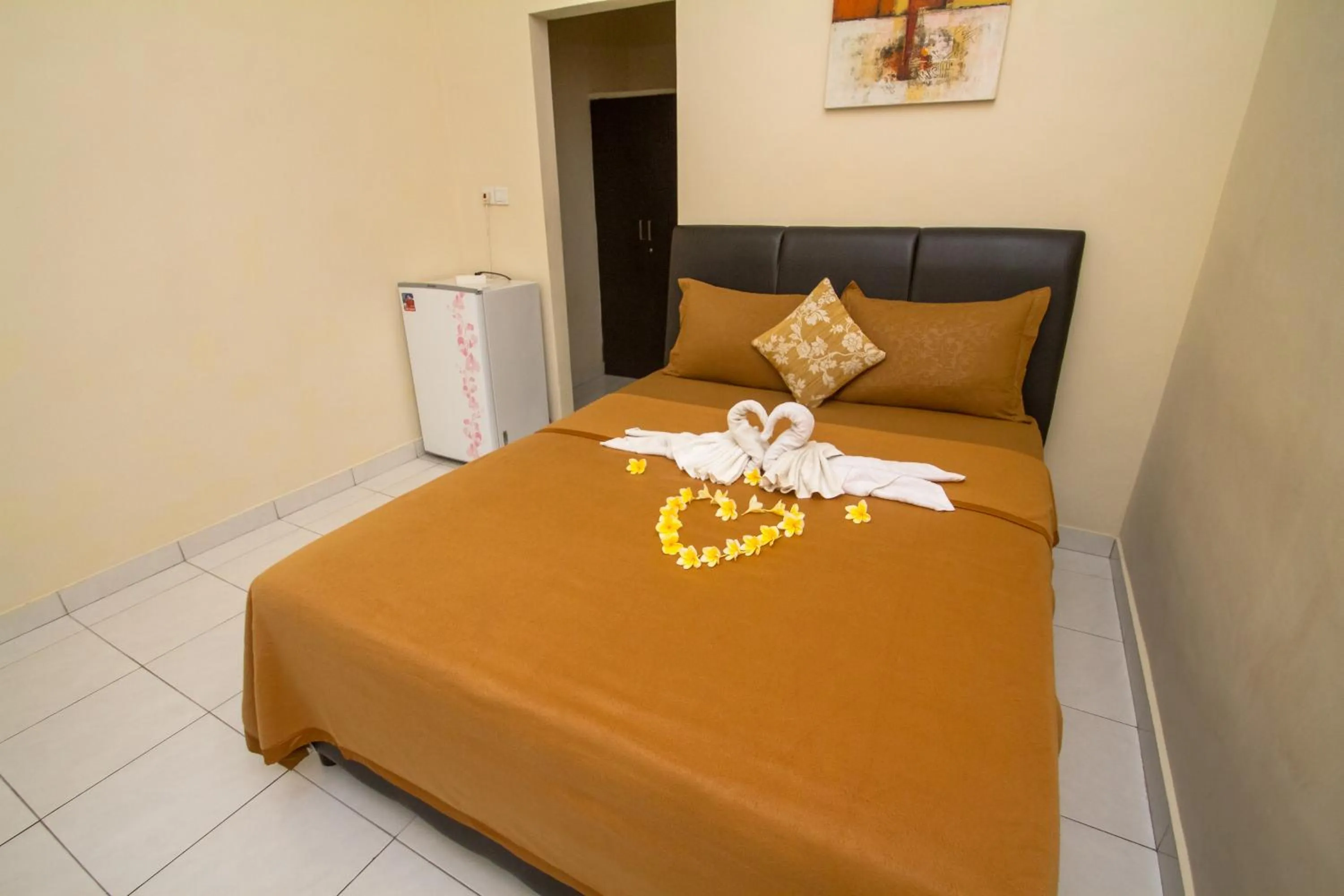 Bed in Seminyak Point Guest House