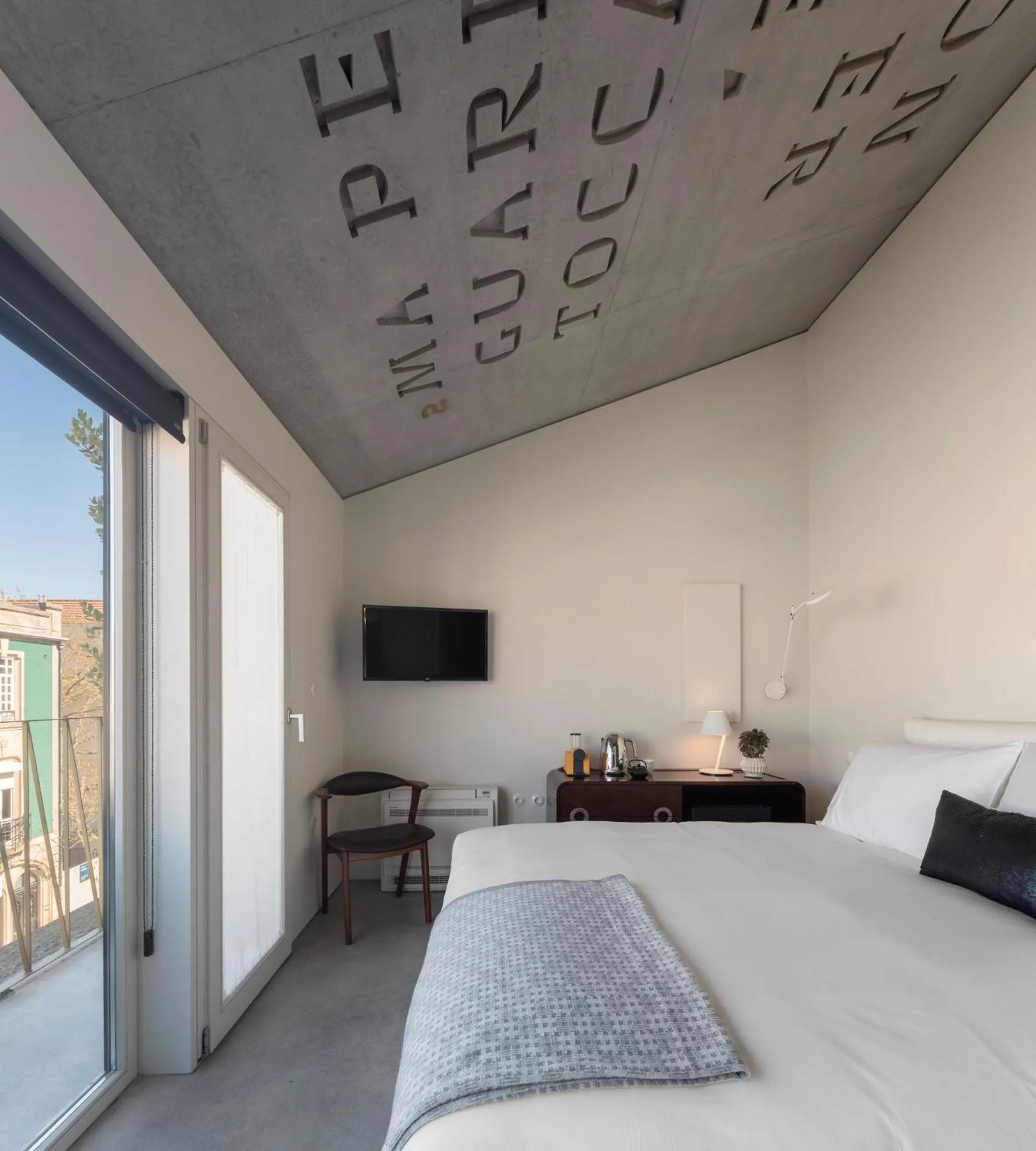 Bed in Hotel Tipografia do Conto by Casa do Conto