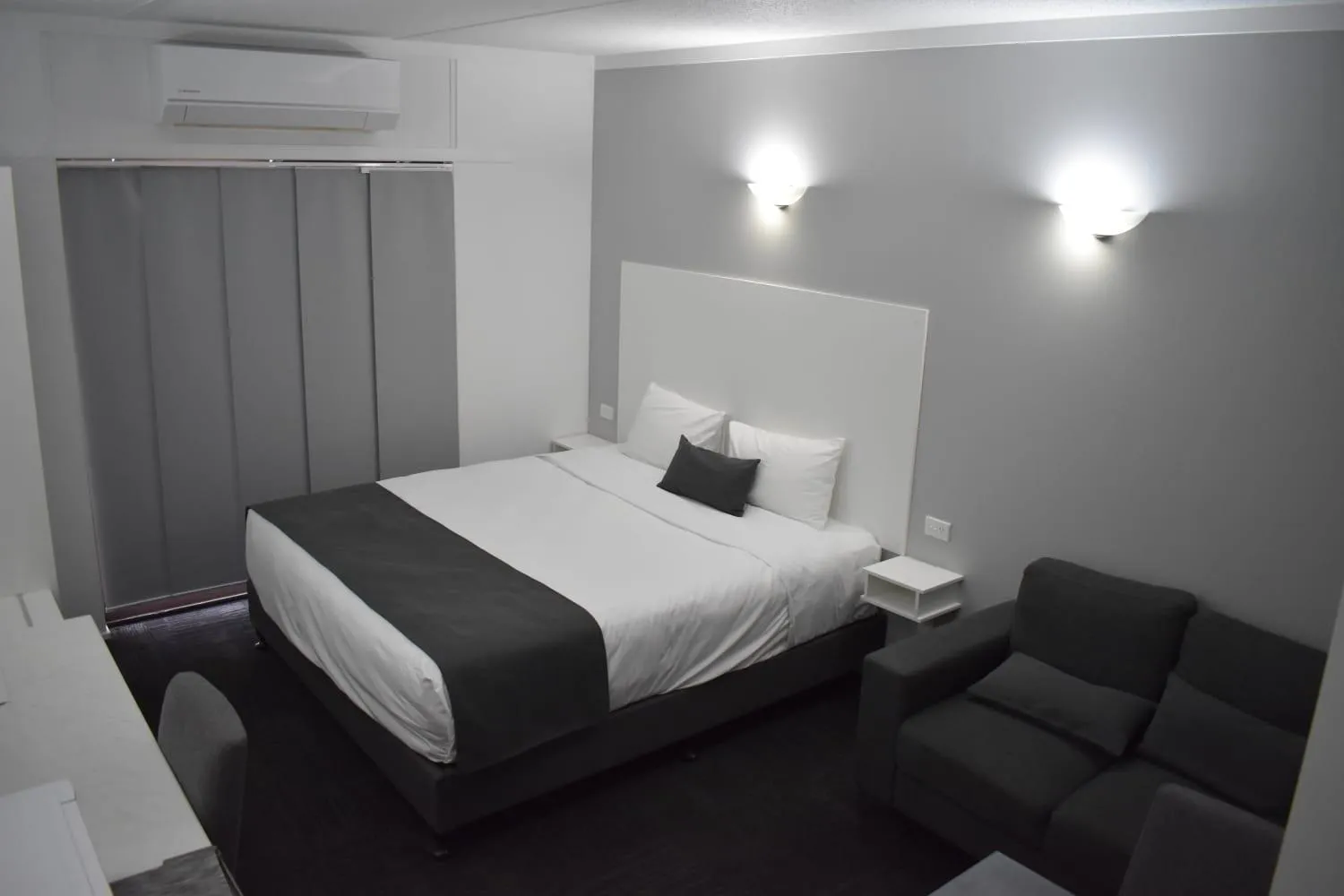 Bed in Riviana Motel