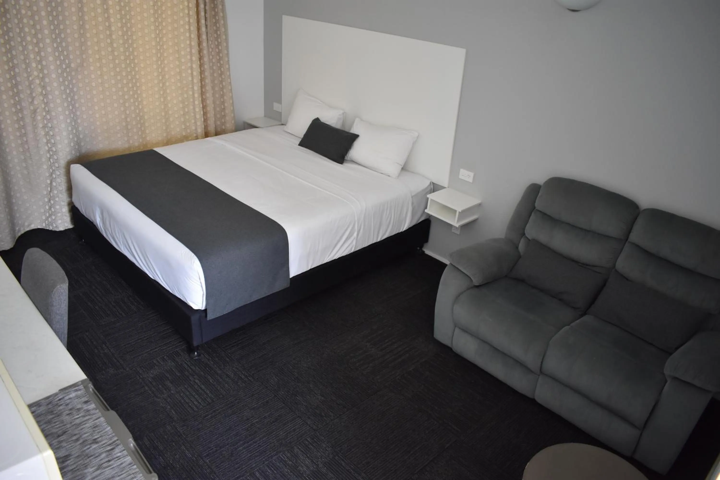 Bed in Riviana Motel
