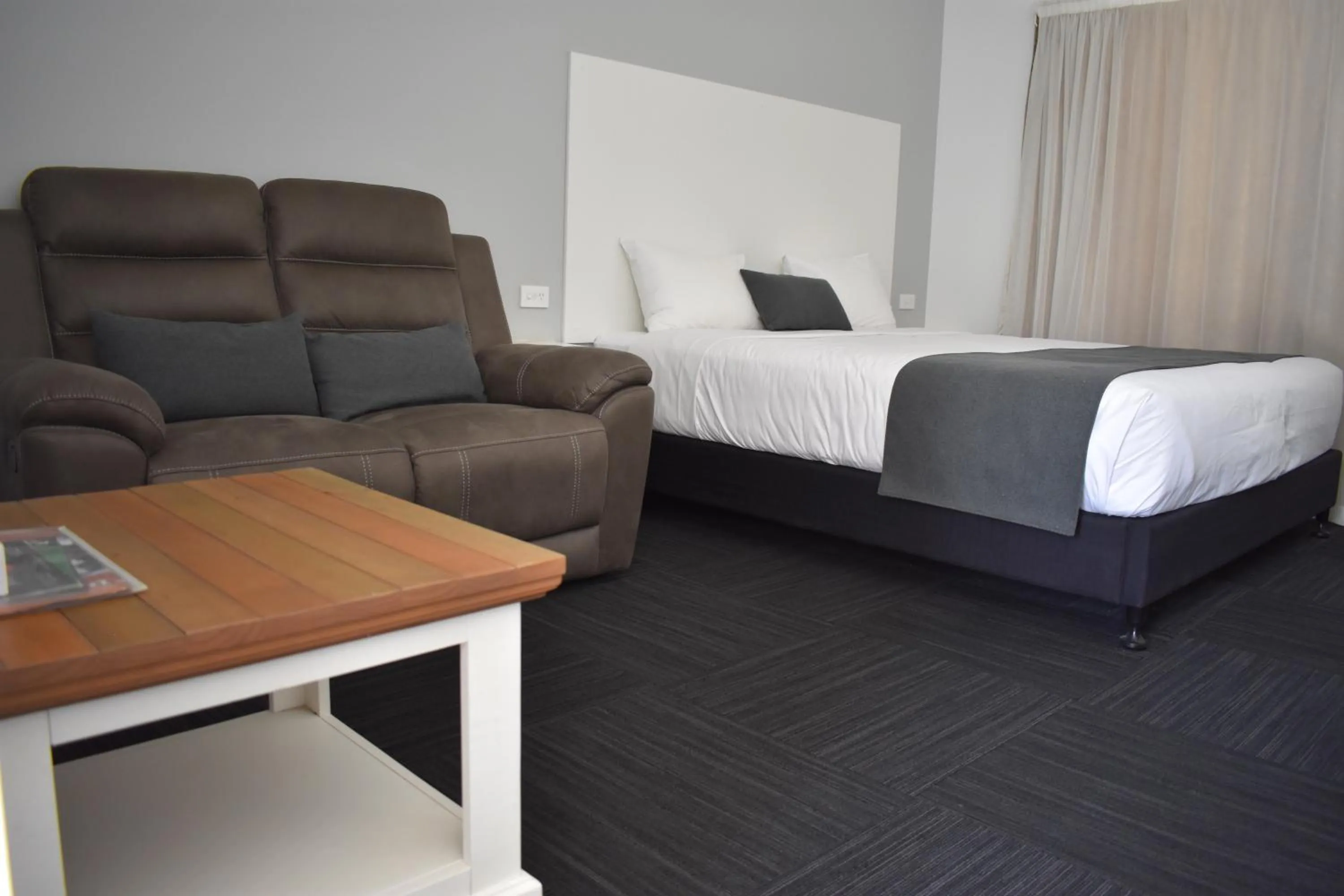 Bed in Riviana Motel