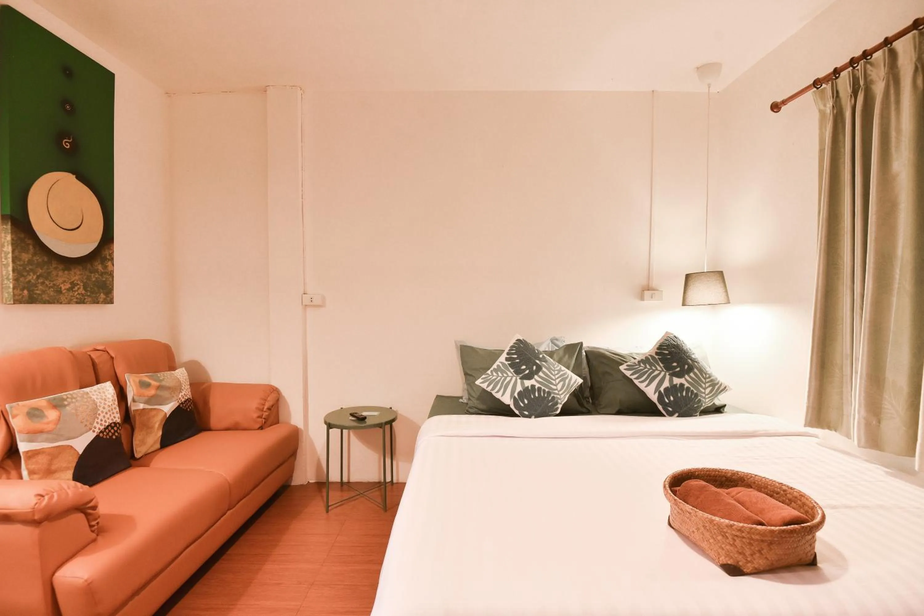 Seating area, Bed in P.U. Inn Resort