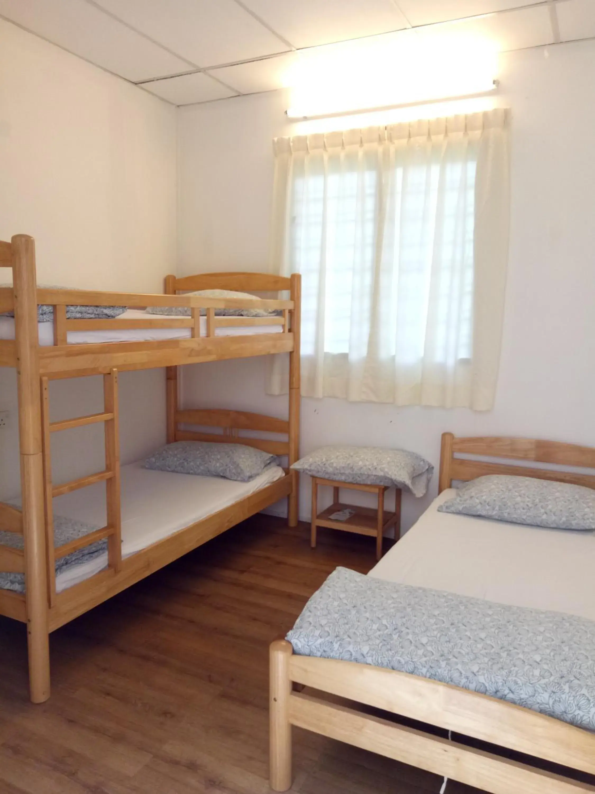 Triple Room with Shared Bathroom (Single + Bunk Bed) in Moonriver Lodge Triple Room with Shared Bathroom (Single + Bunk Bed) in Moonriver Lodge