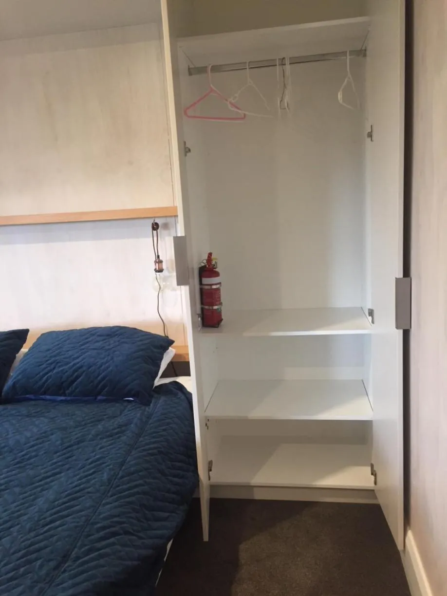wardrobe, Bed in Kotahi Cottage