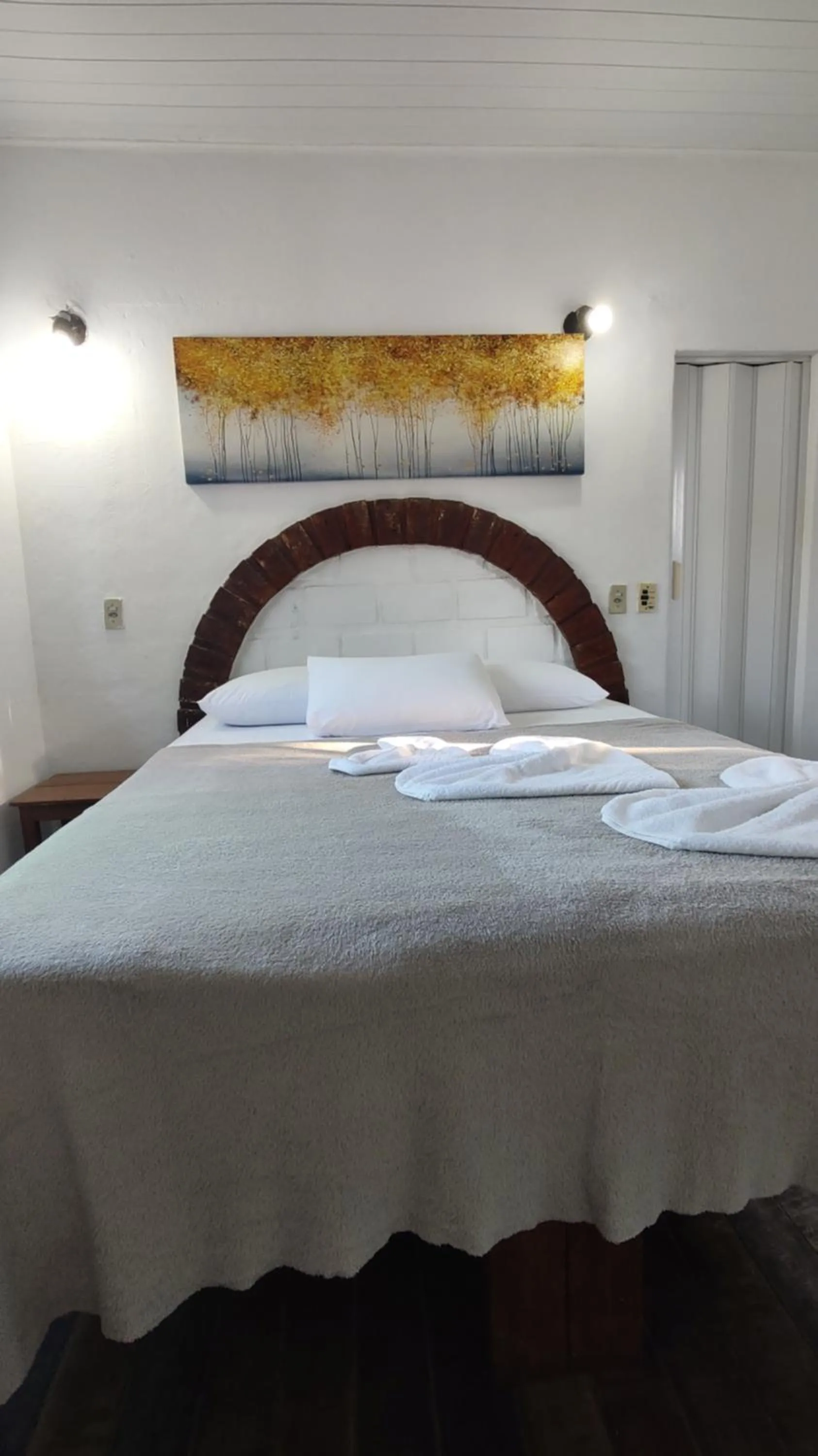 Bed in Pousada Lá na Magia