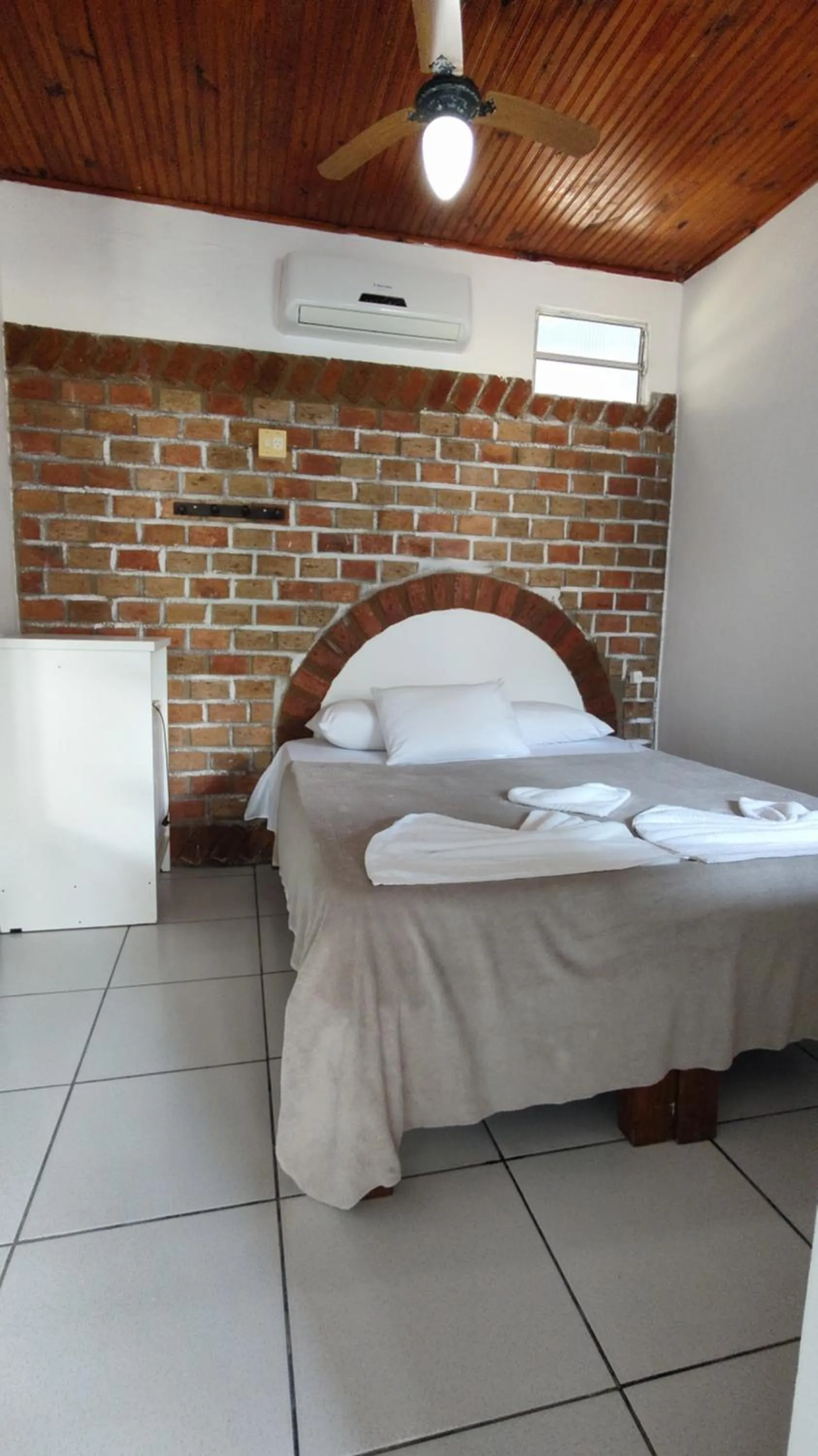 Bed in Pousada Lá na Magia