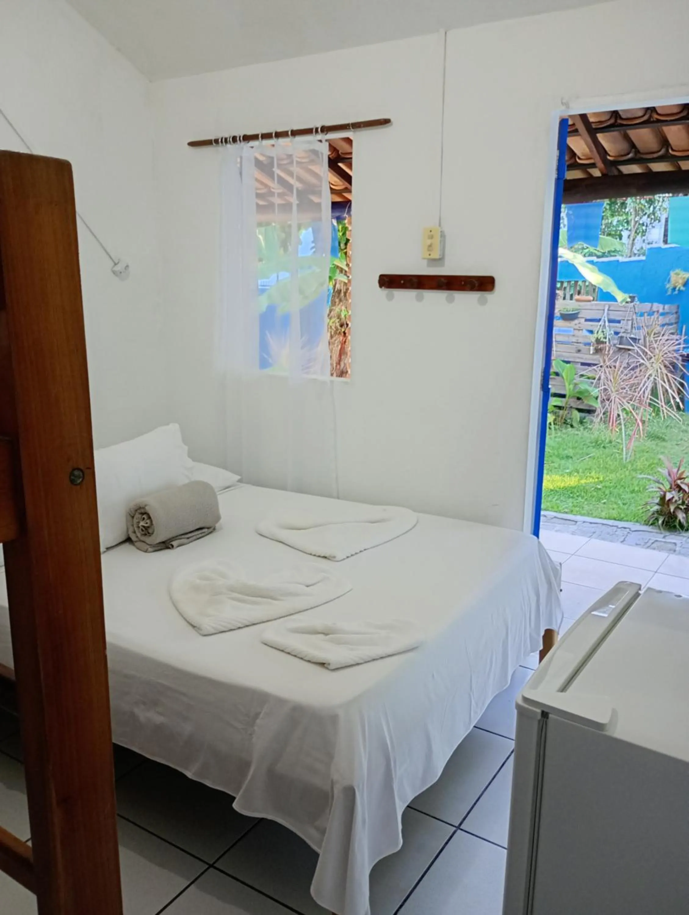 Bed in Pousada Lá na Magia