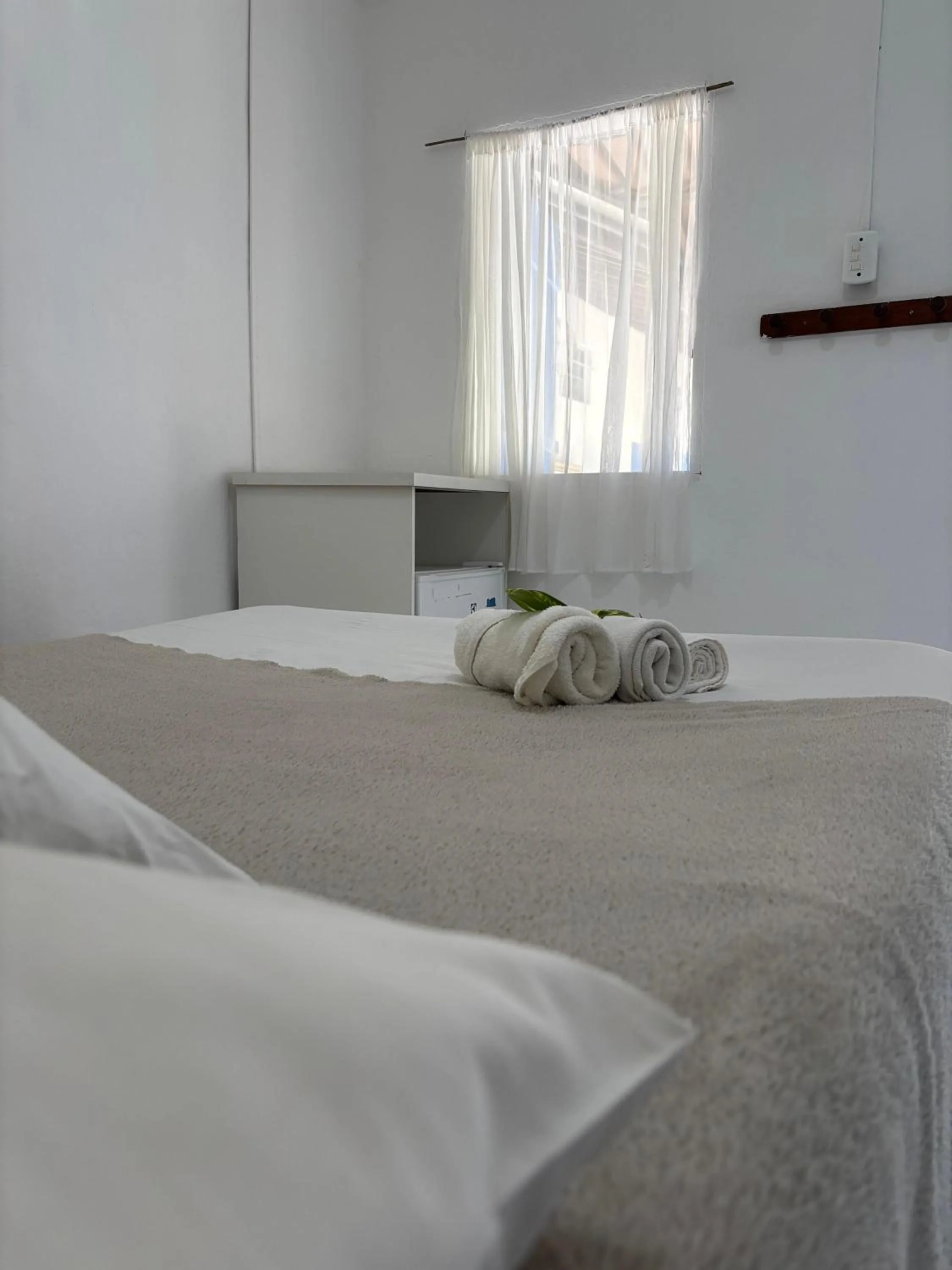 Bed in Pousada Lá na Magia