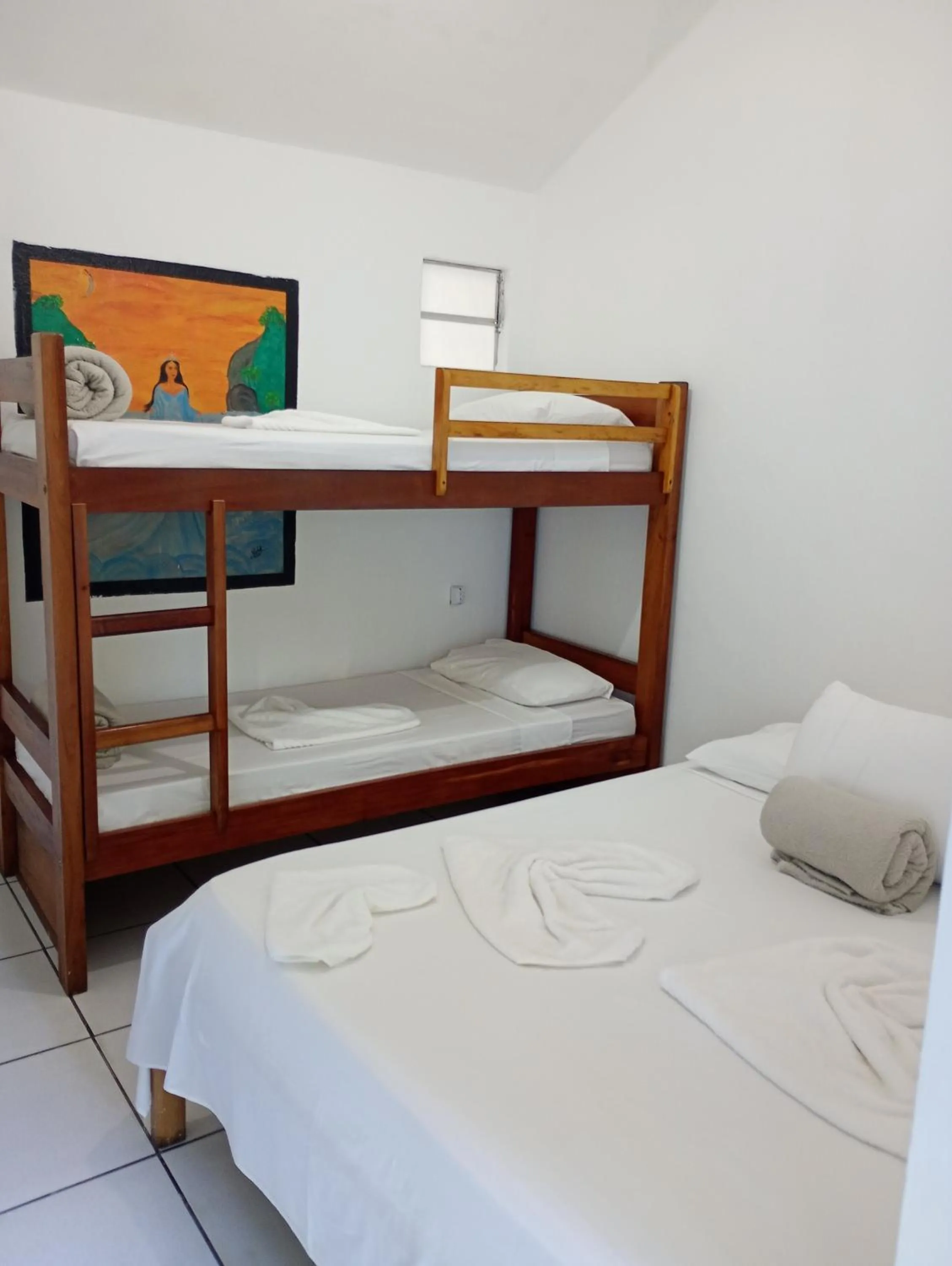 Bed in Pousada Lá na Magia