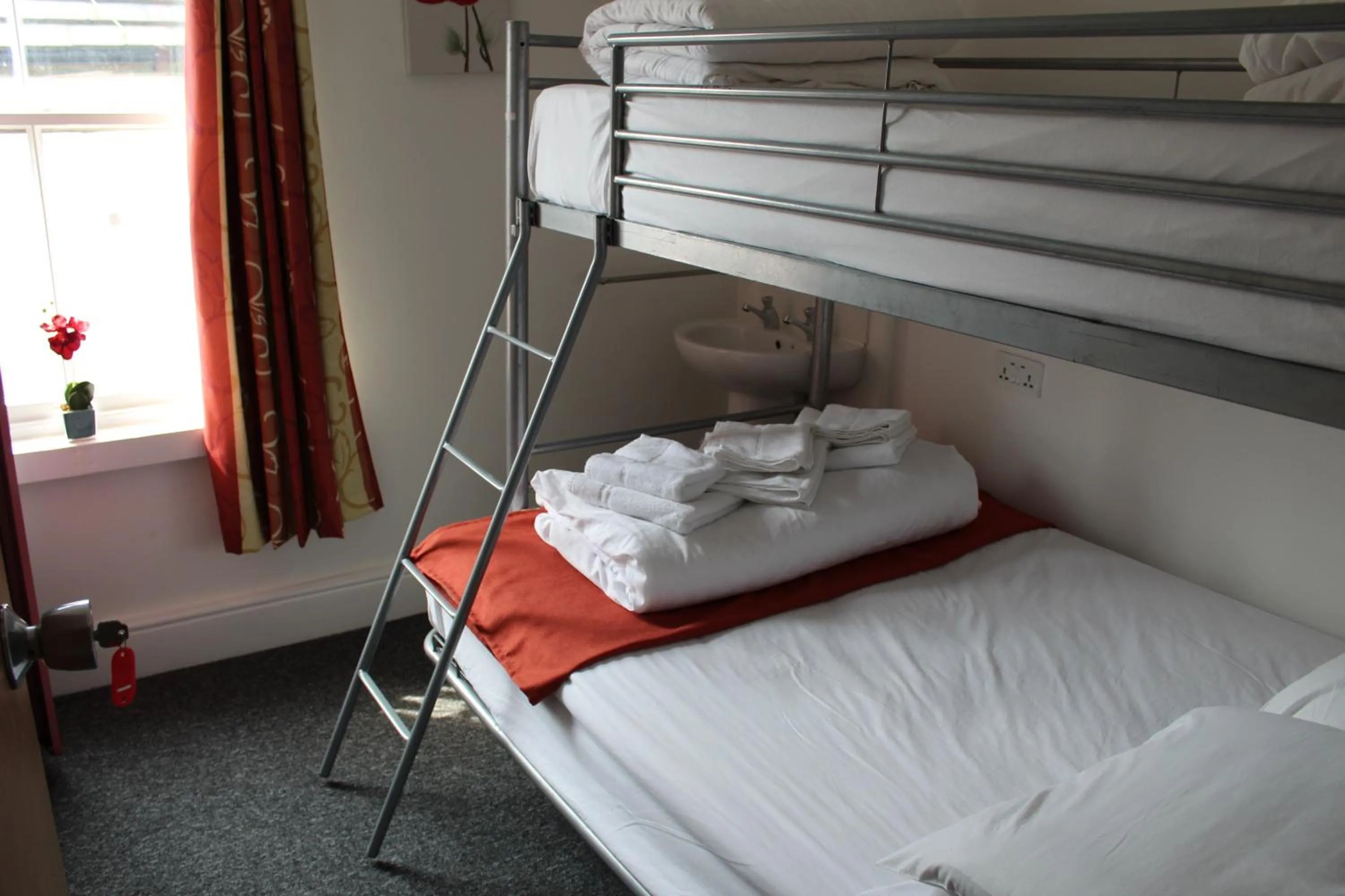 Photo of the whole room, Bed in Backpackers Blackpool Hotel & Suites