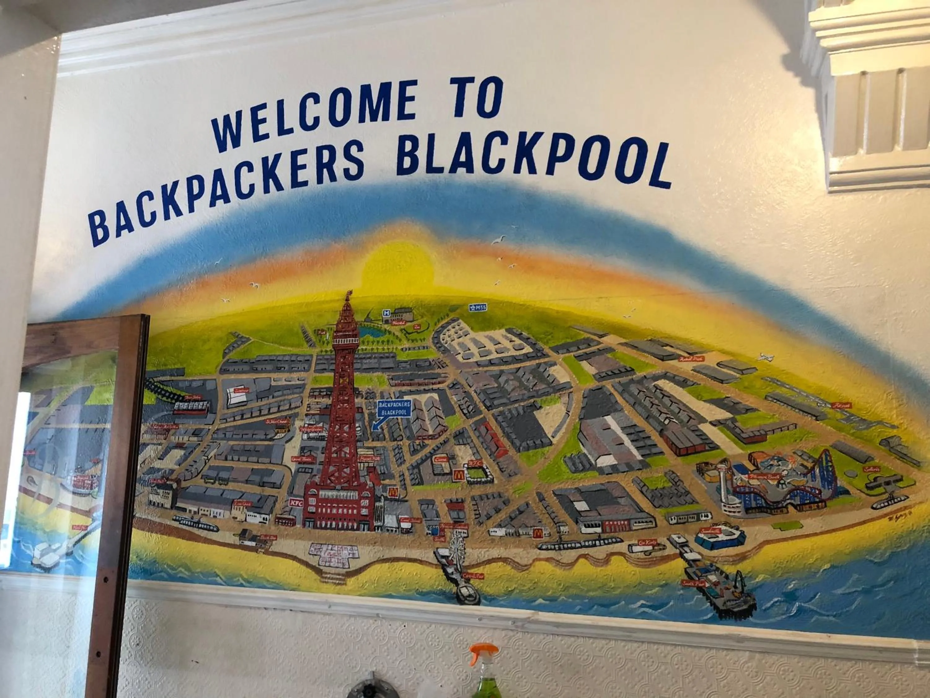 Text overlay in Backpackers Blackpool Hotel & Suites
