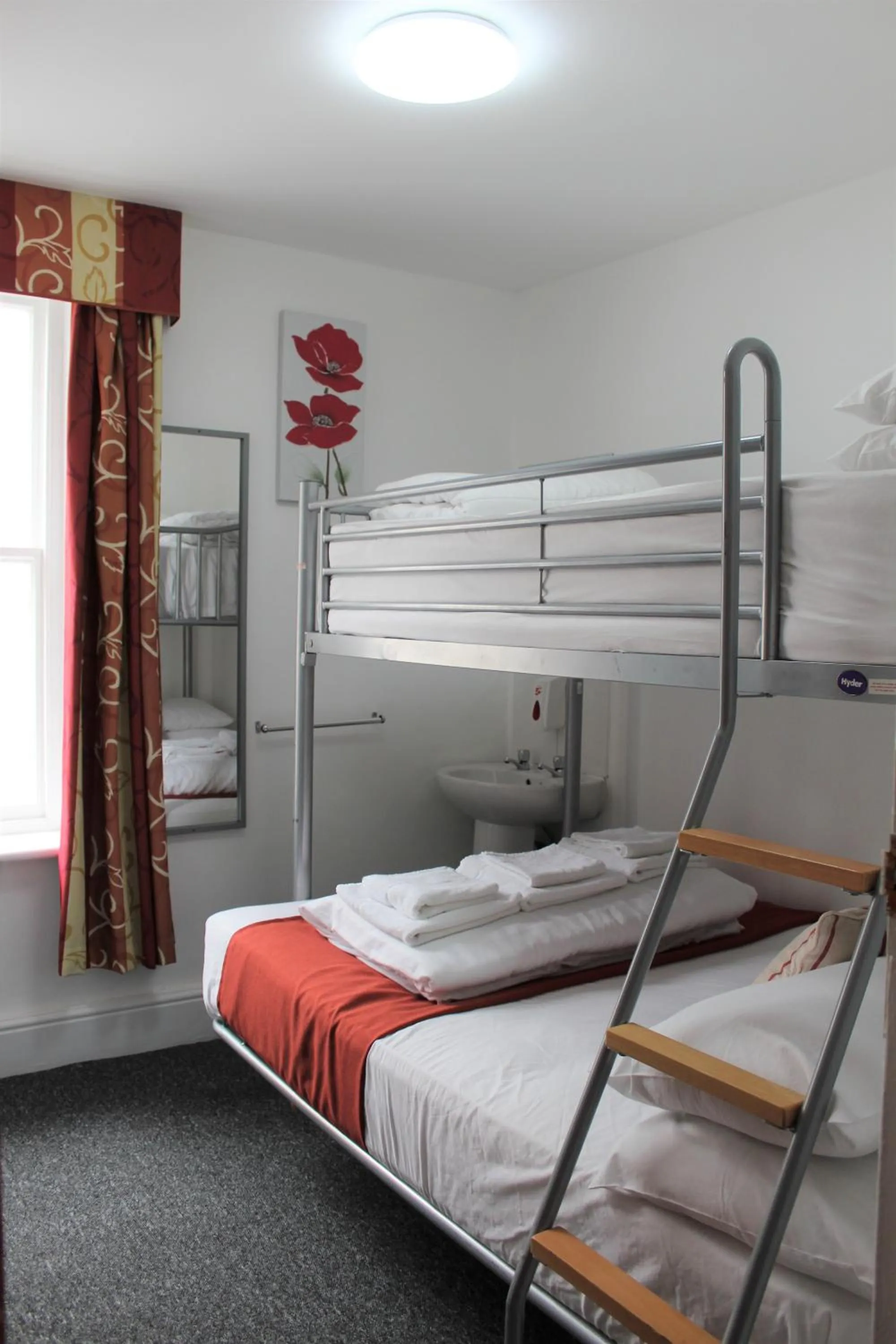 Photo of the whole room, Bed in Backpackers Blackpool Hotel & Suites