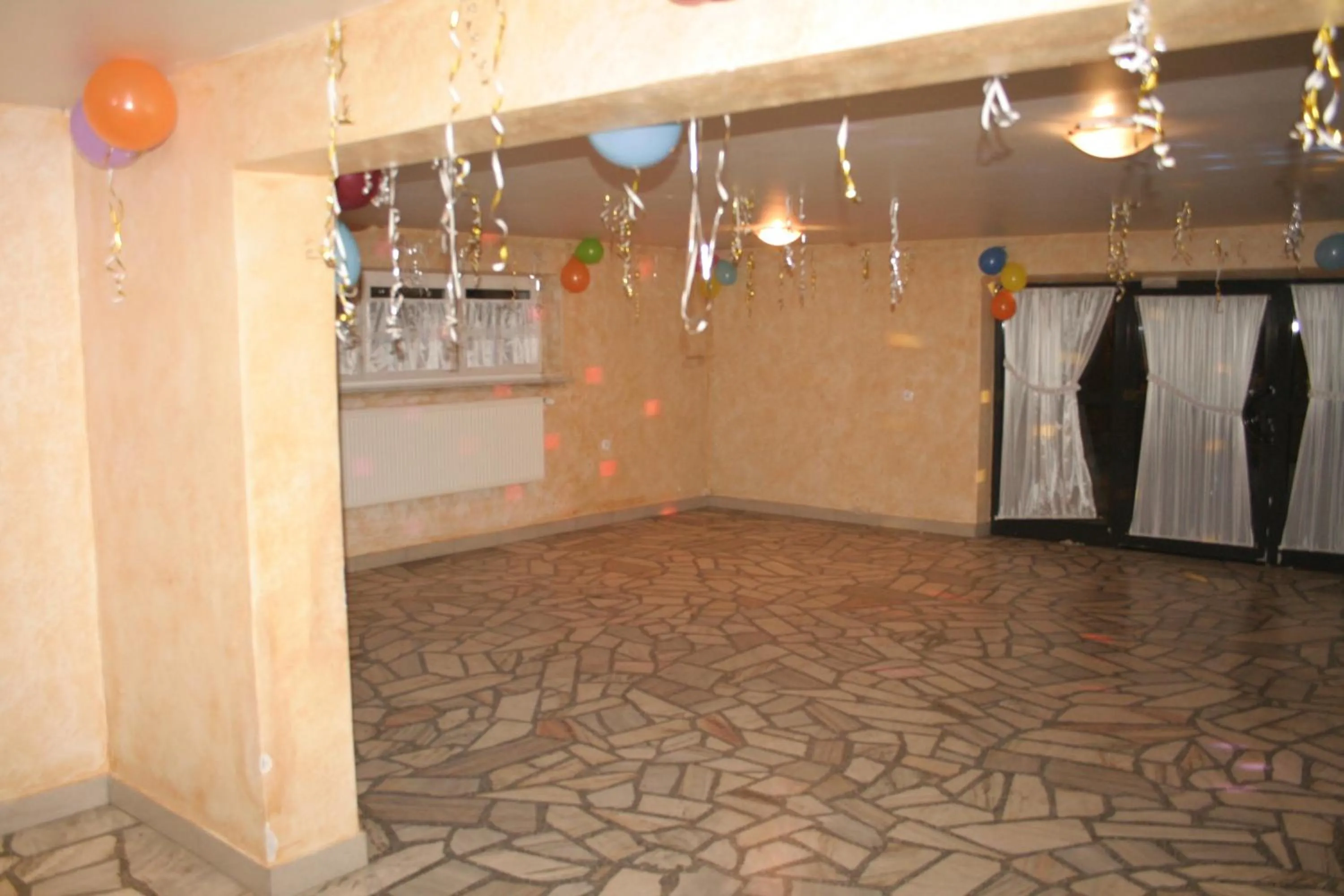 Communal lounge/ TV room in Dom Wypoczynkowy Tulipan