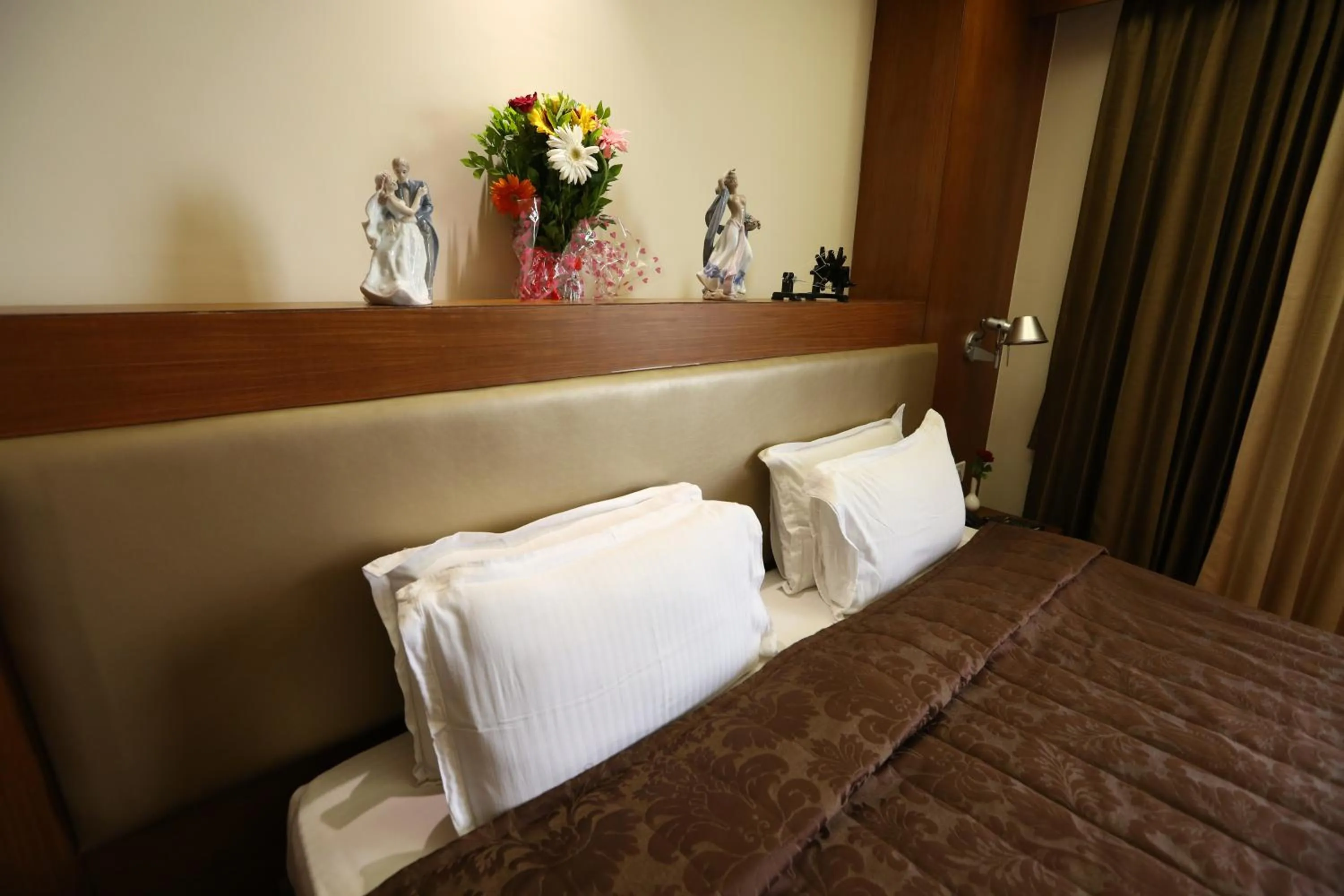 Bed in SilverCloud Hotel and Banquets