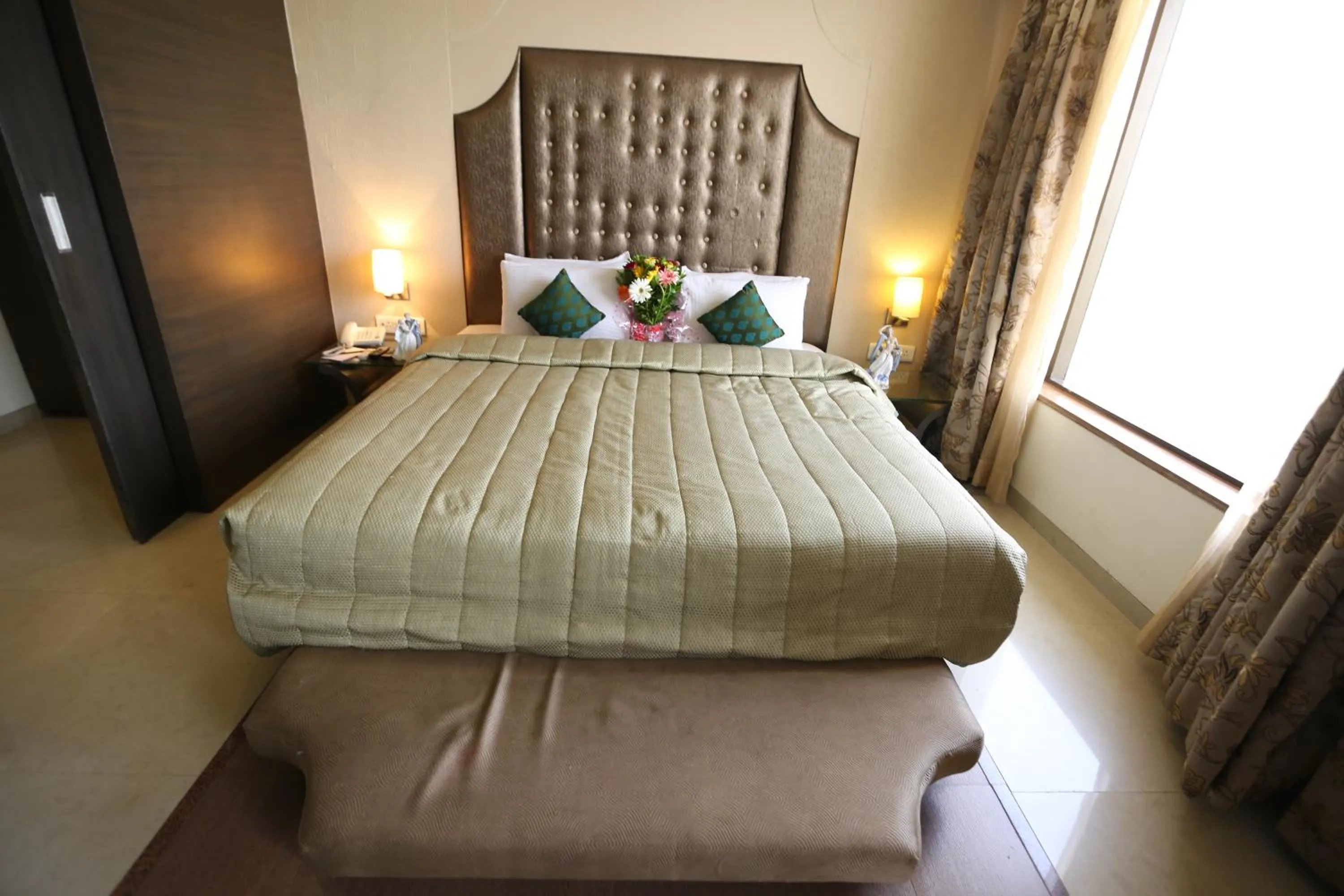 Bed in SilverCloud Hotel and Banquets