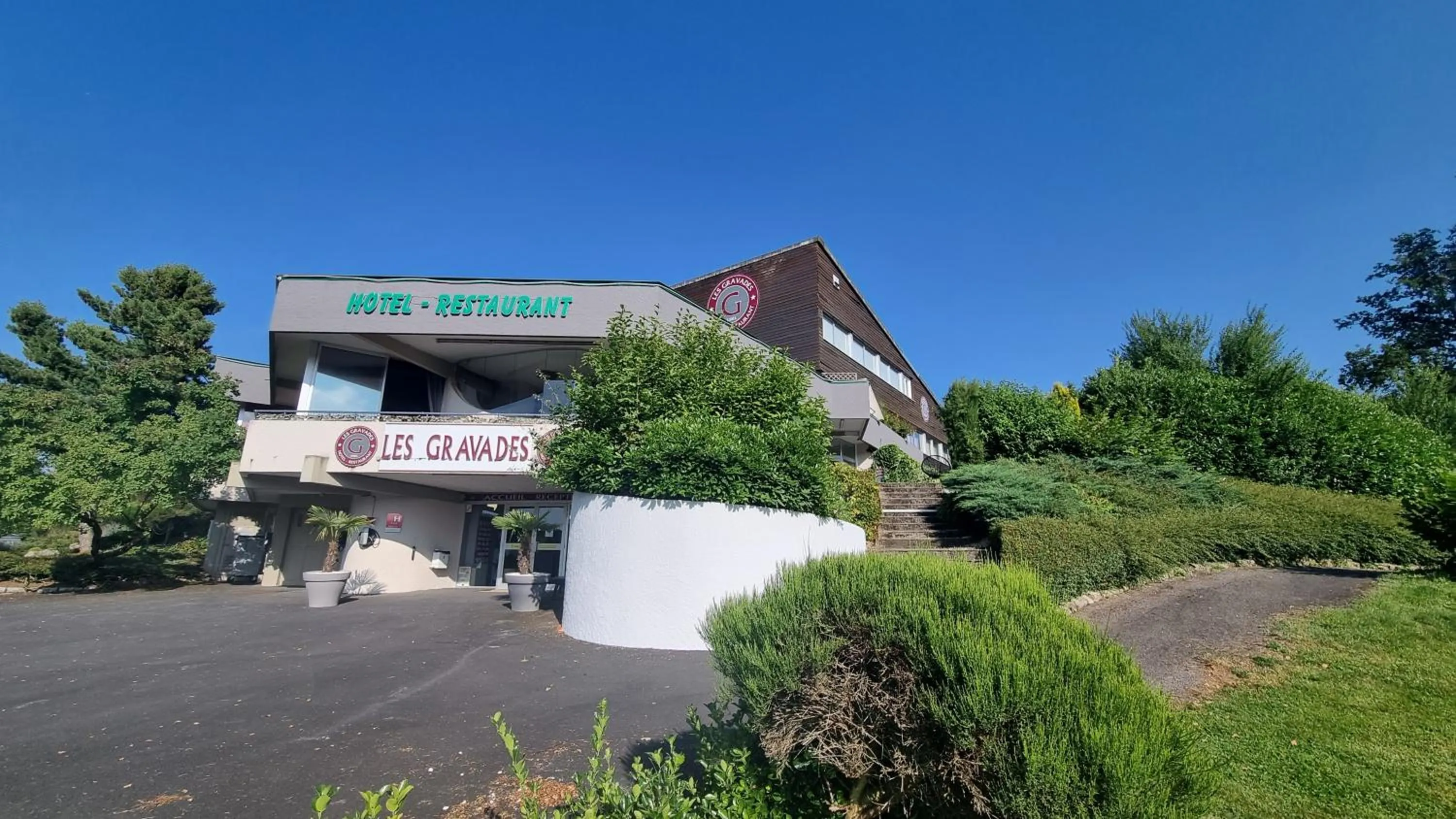 Property building in Logis Hotel Les Gravades Ussel