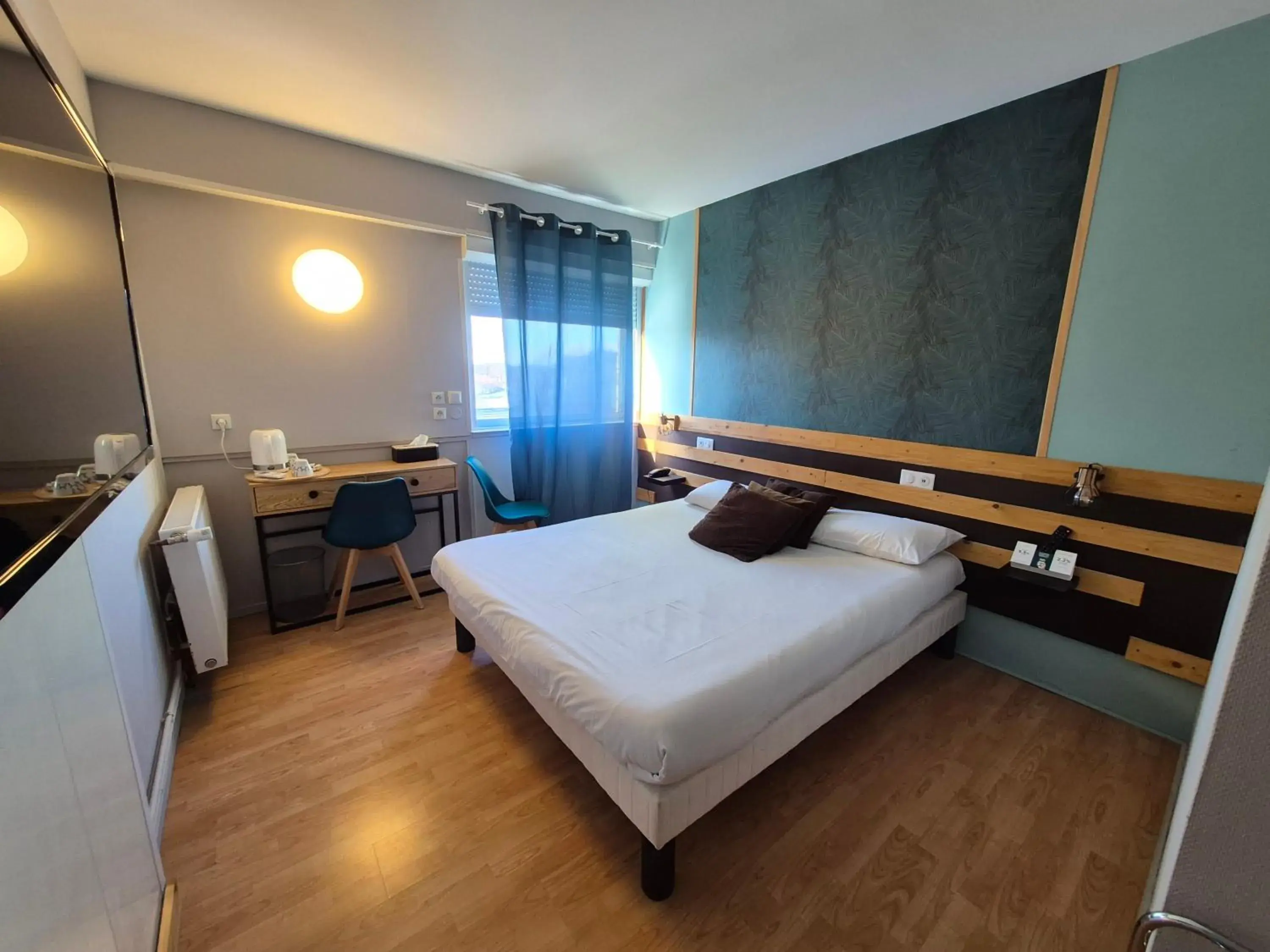 Bed in Logis Hotel Les Gravades Ussel Bed in Logis Hotel Les Gravades Ussel