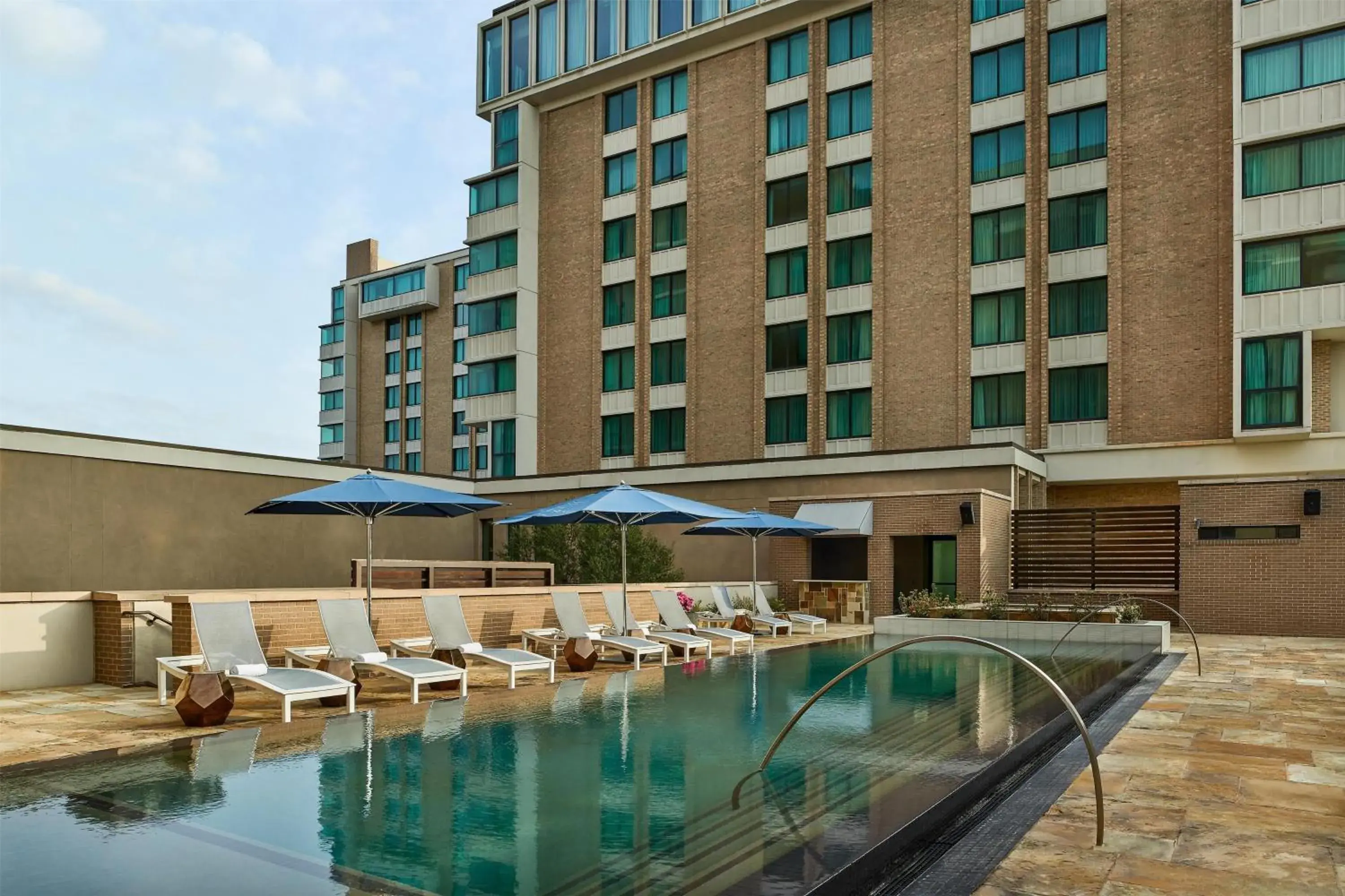 Pool view in The Highland Dallas, Curio Collection by Hilton Pool view in The Highland Dallas, Curio Collection by Hilton