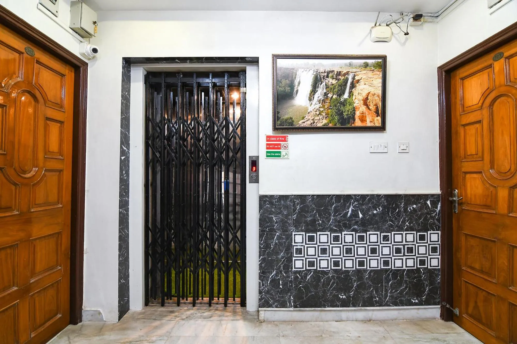 elevator in FabHotel Wild Orchid - 800m from Medica Superspecialty Hospital