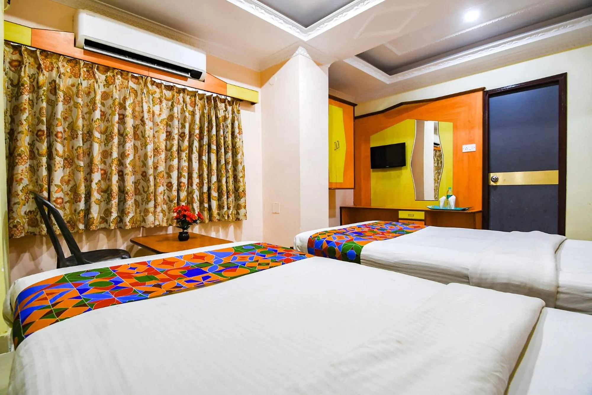 Bed in FabHotel Wild Orchid - 800m from Medica Superspecialty Hospital
